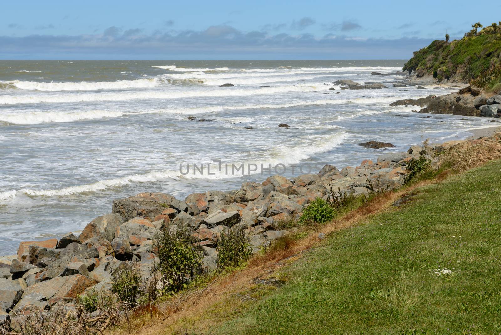 Big waves and huge boulders on the Pacific Ocean coast near the Kaka Point, New Zealand