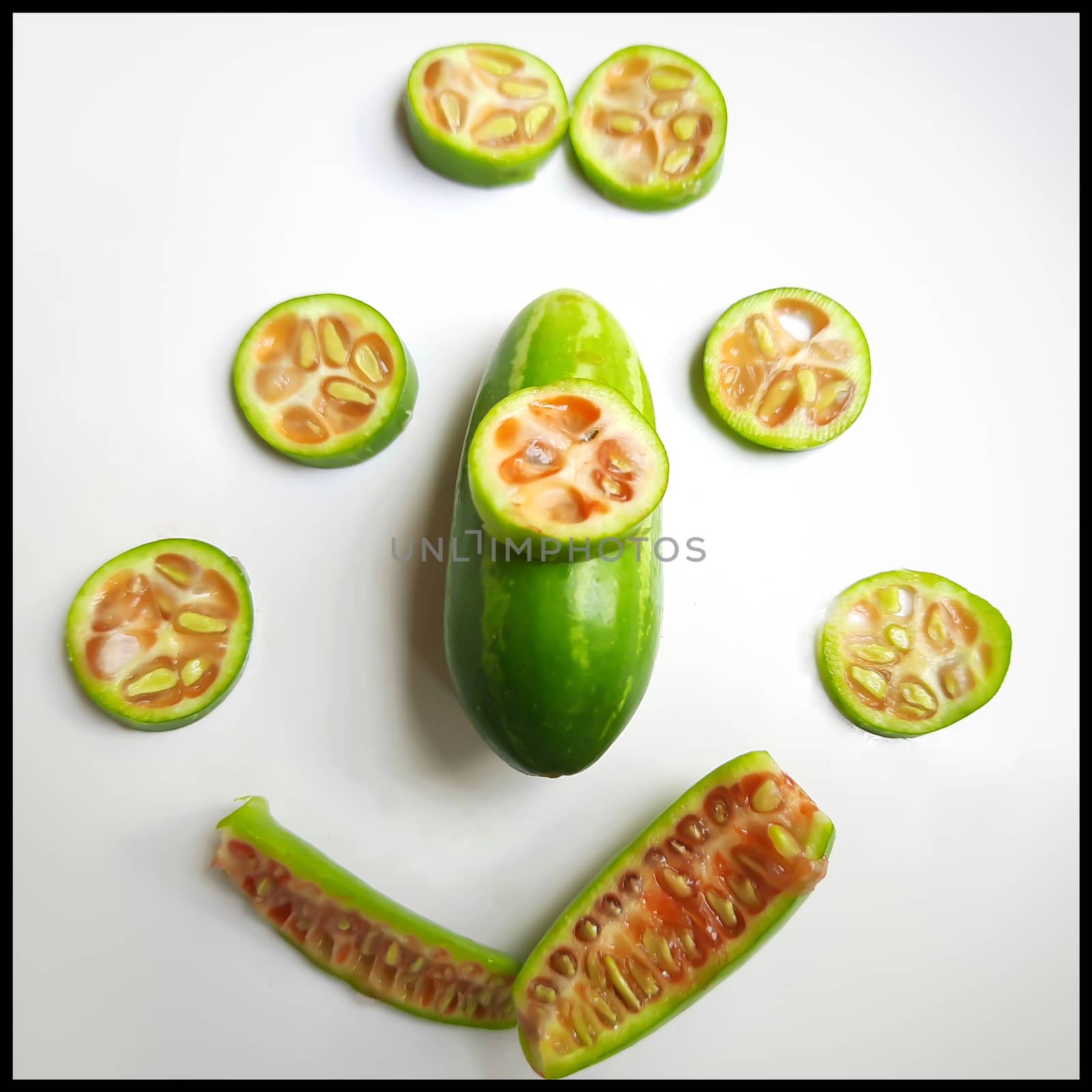 fresh scarlet gourd and it cut into pieces round and vertical shape in white plate dietary supplement and prevent high cholesterol to high blood pressure