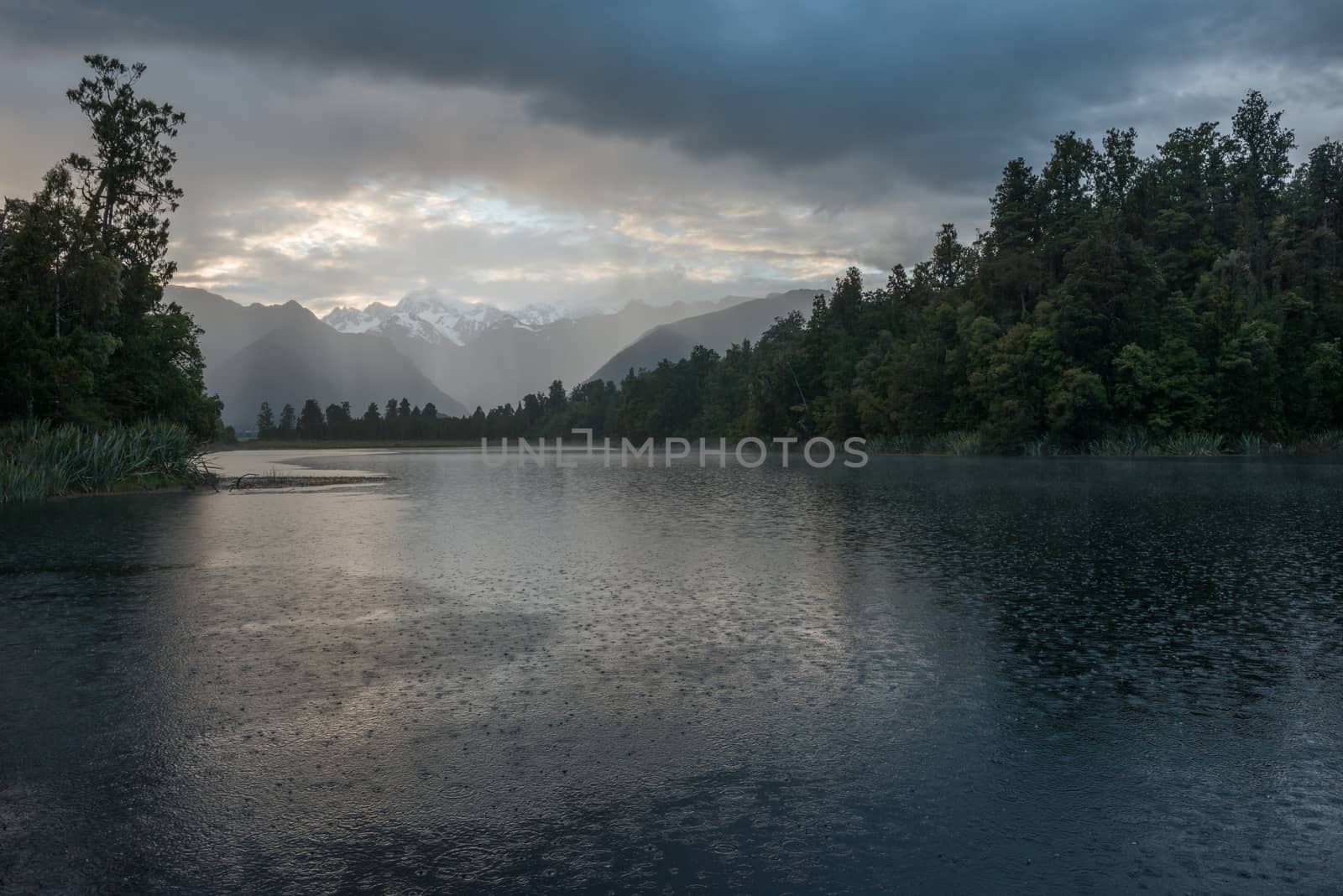 Depressed cloudscape and strong rain over the Lake Matheson by nemo269