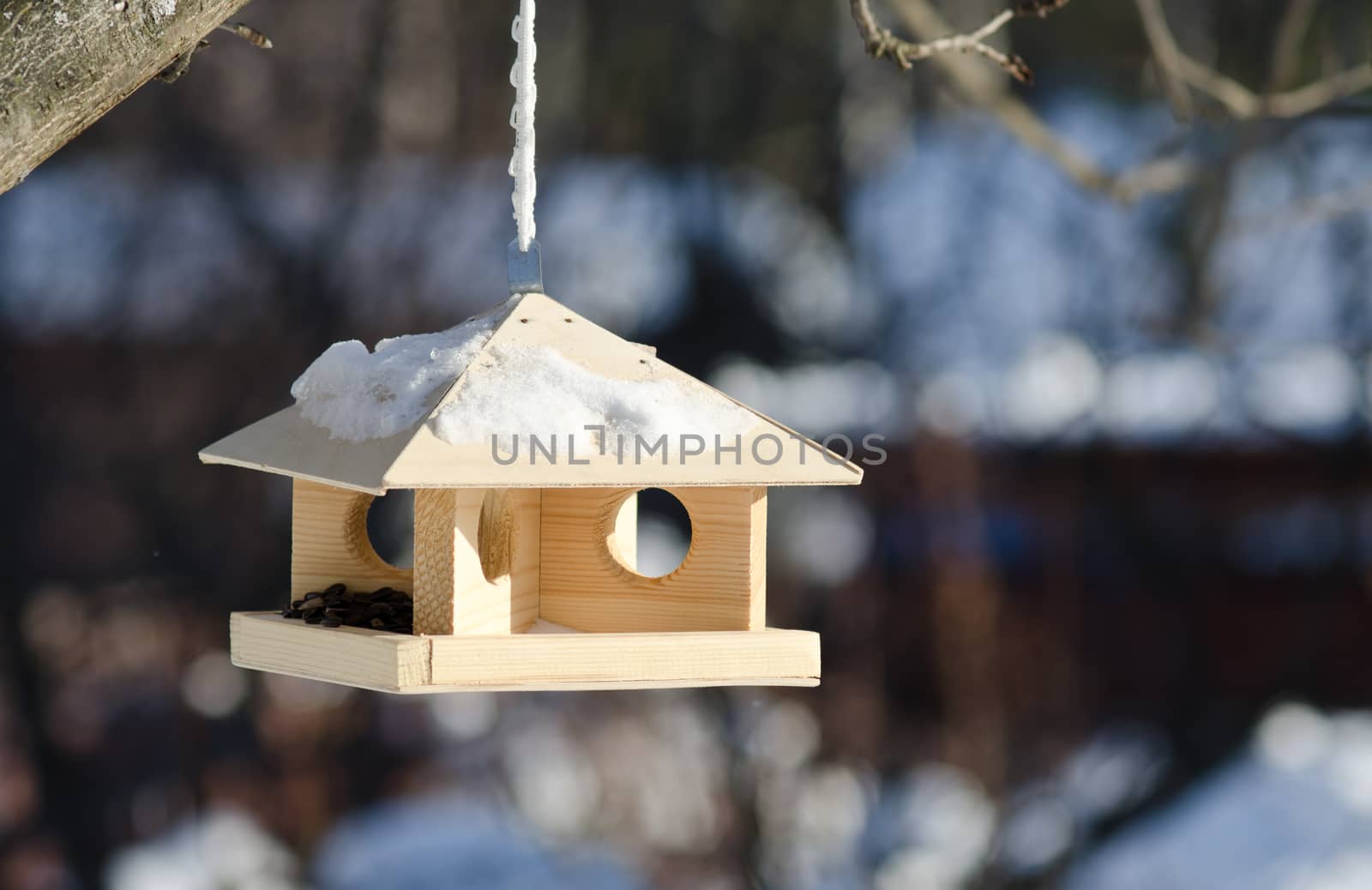 Close up view of the feeding rack with the blurred rural background