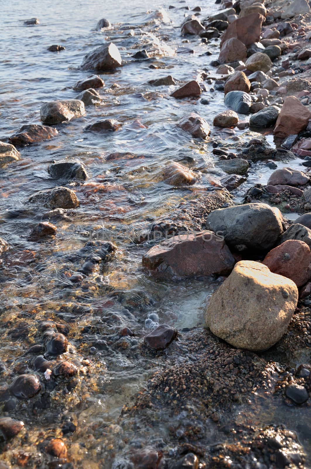 Coastal stones and rocks at the evening surf by nemo269