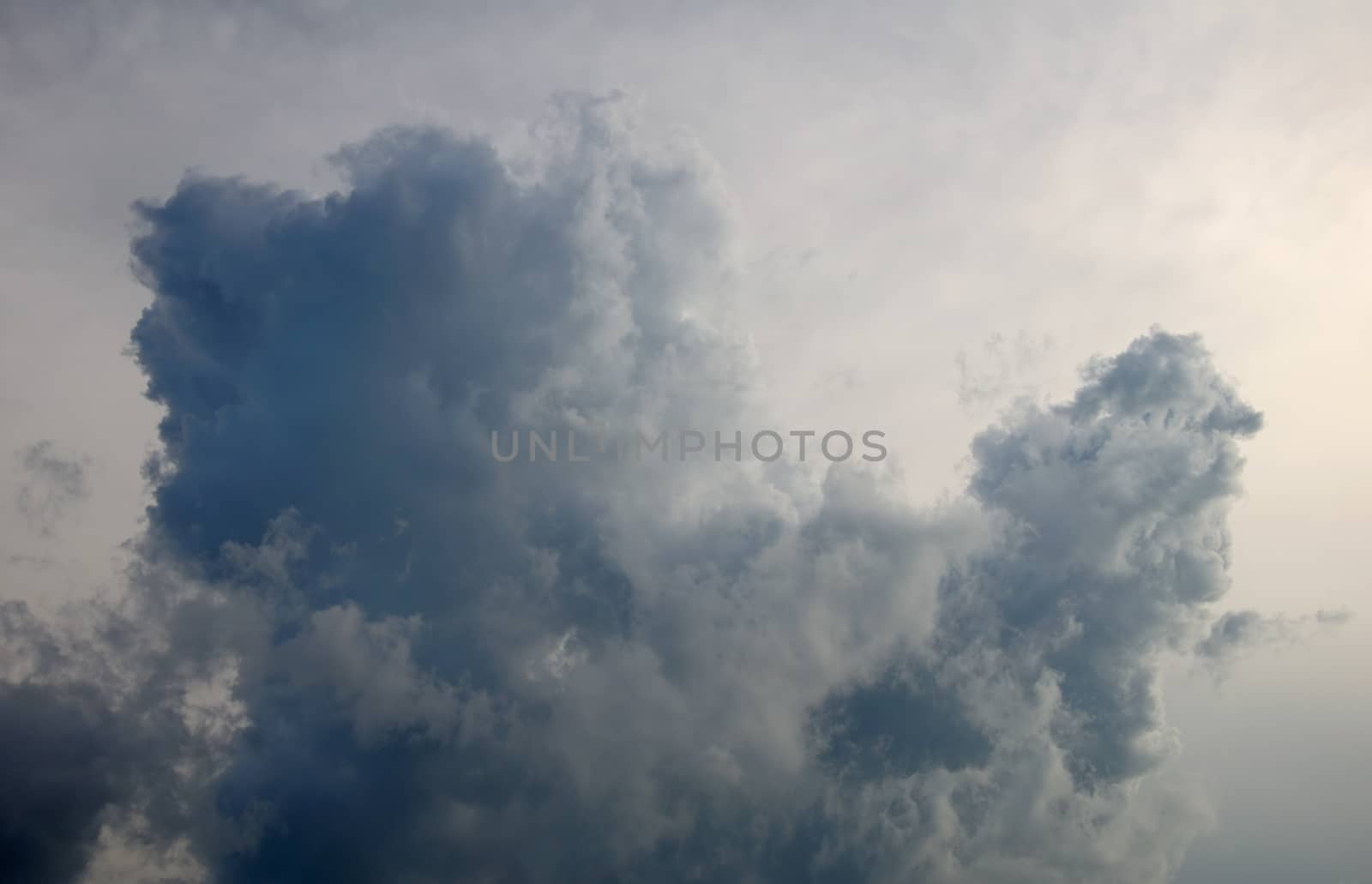 The huge and depressing lowering clouds fill the sky