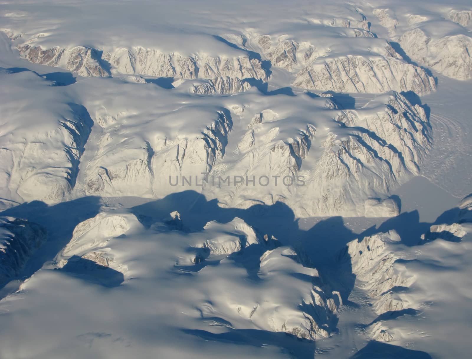 Aerial view of the Greenland with glacier, mountains, ocean fields, rocks...