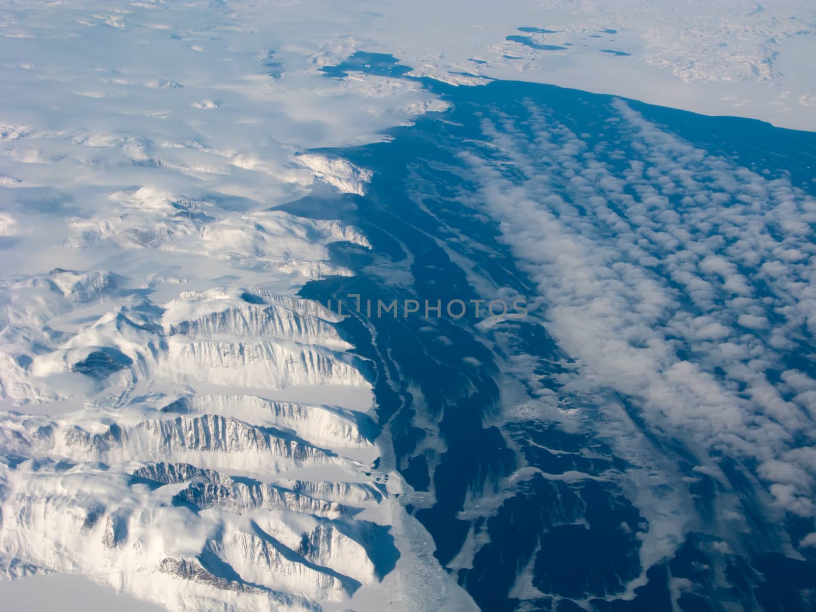 Aerial view of the Greenland gulf with mountain and ocean