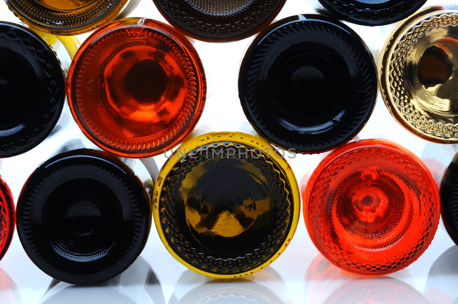 Closeup of the bottom side of wine bottles by sCukrov
