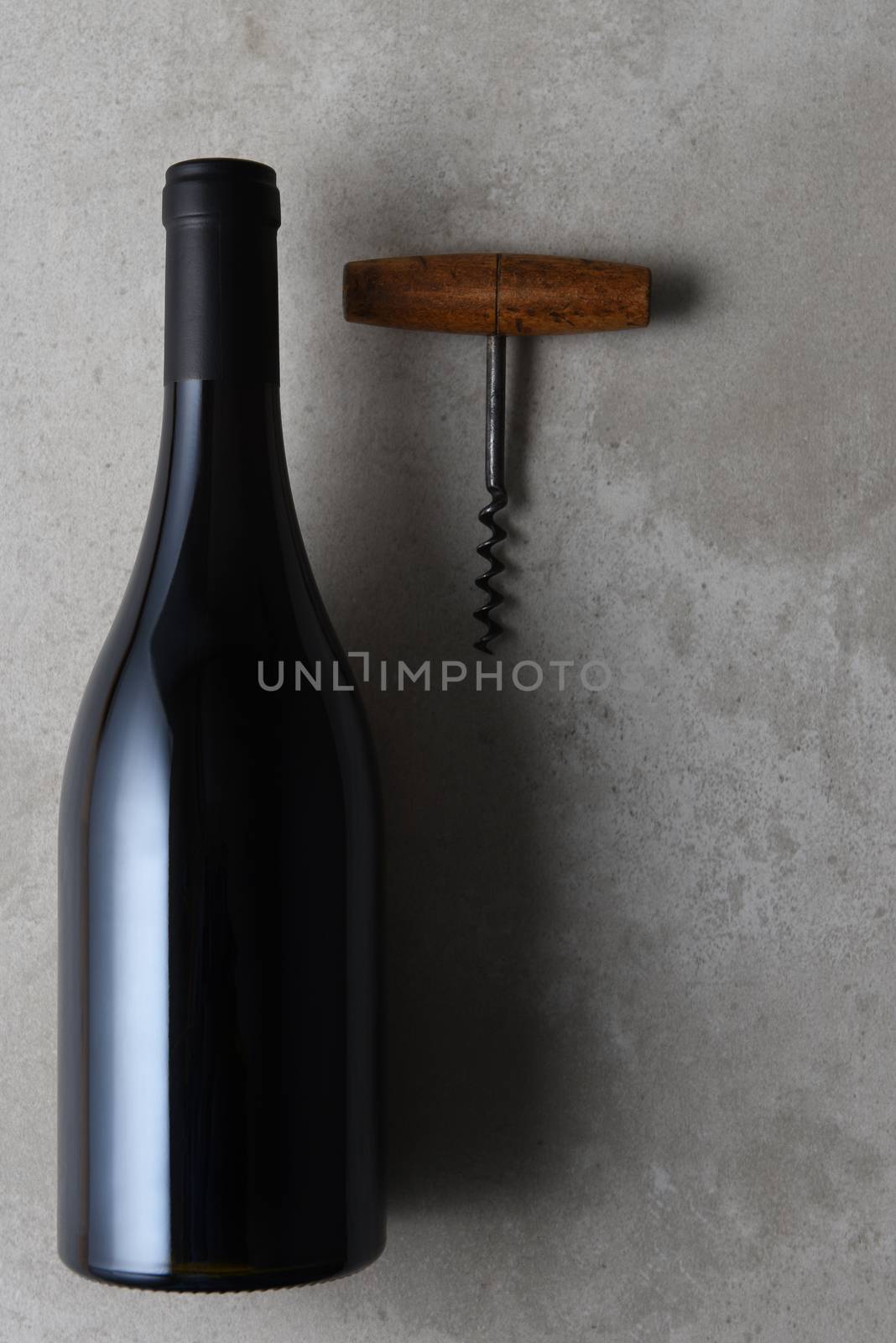 Flat lay still life of a pinot noir shaped wine bottle  by sCukrov
