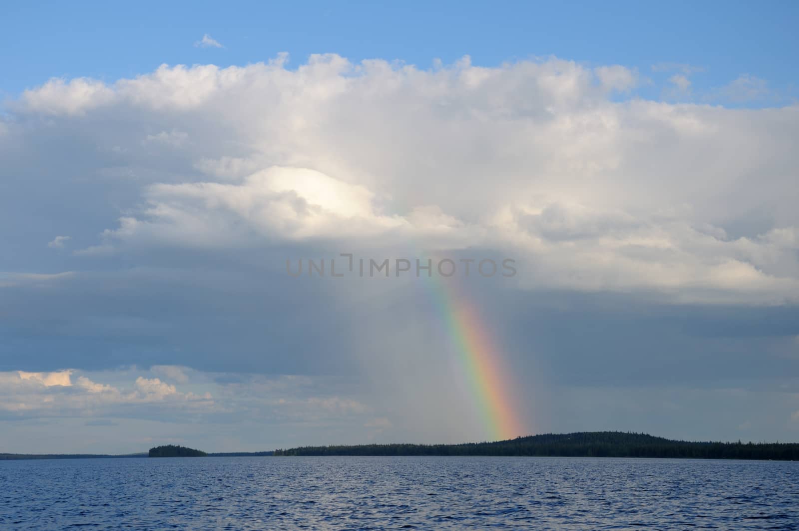 Colorfull rainbow under single cloud over lake by nemo269