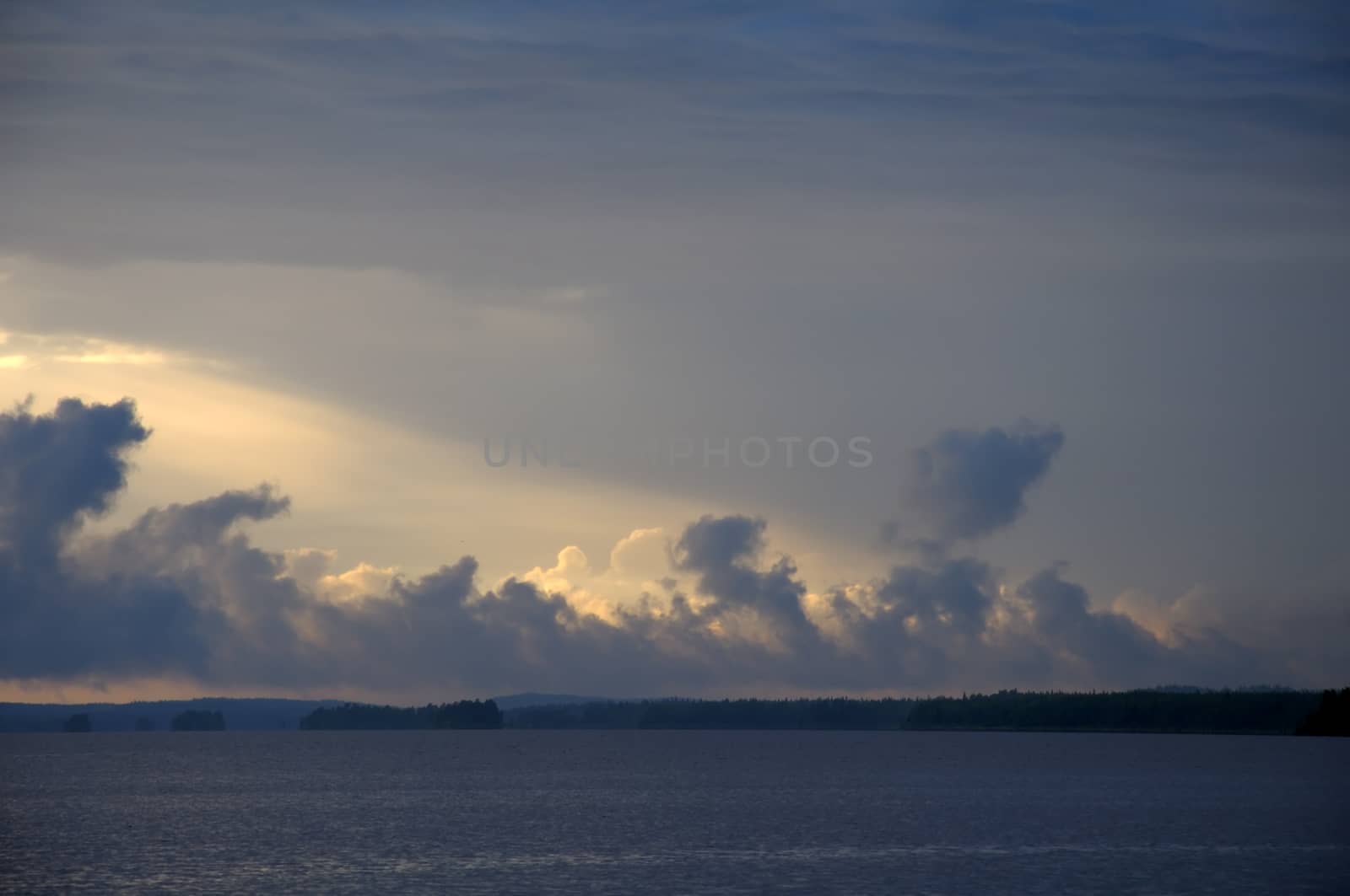 The picture shows rainstrom and thunderstorm clouds over lake