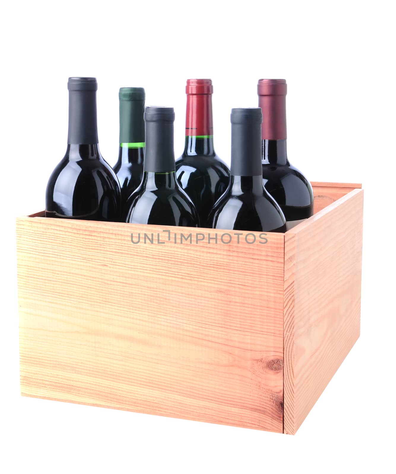 An assortment of Red Wine bottles standing in a wooden crate isolated on a white background.
