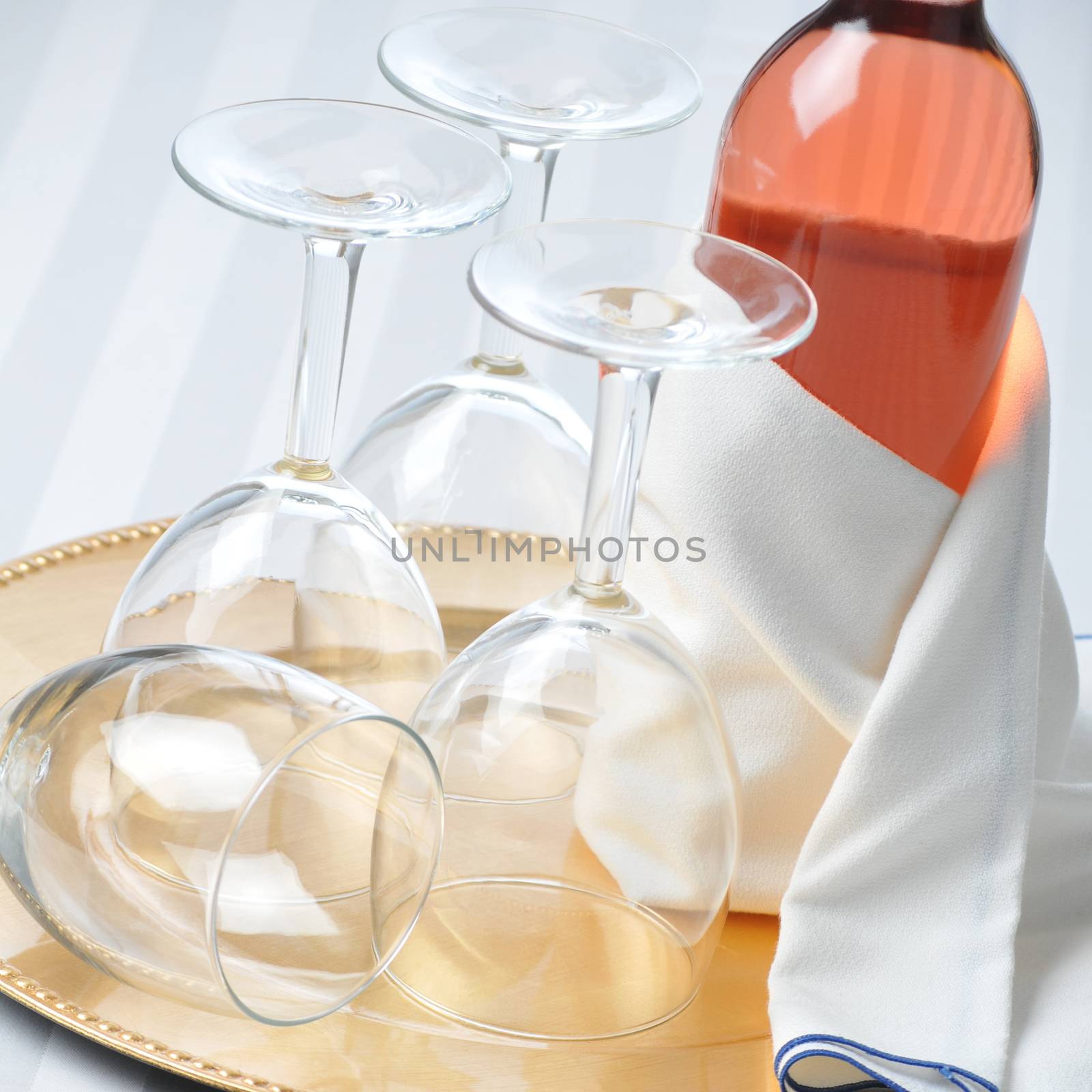 Wine Still Life: Blush Wine Bottle and Glasses on Tray with Glasses, square format.