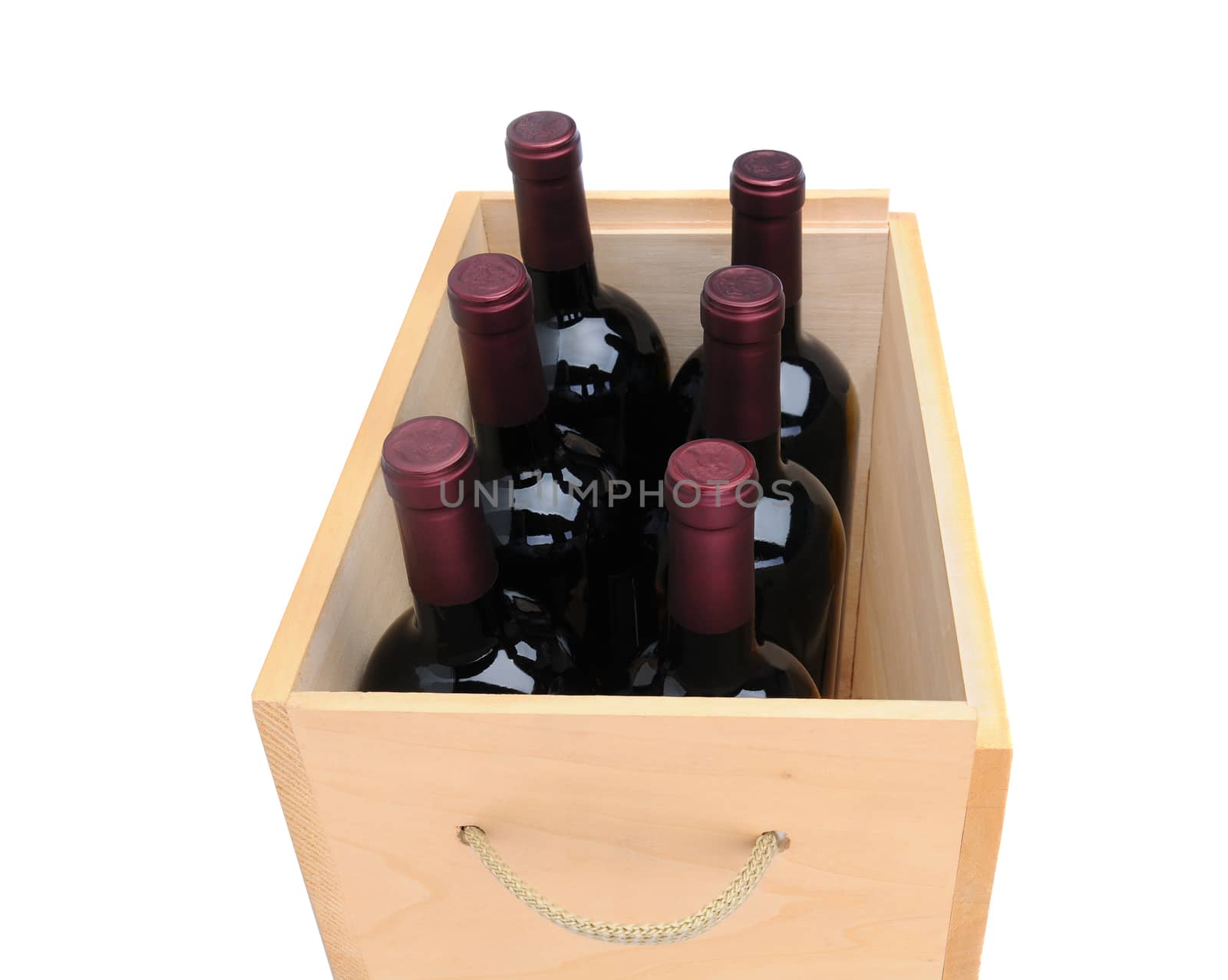Closeup of six Cabernet Sauvignon wine bottles in a wooden crate  isolated on white.