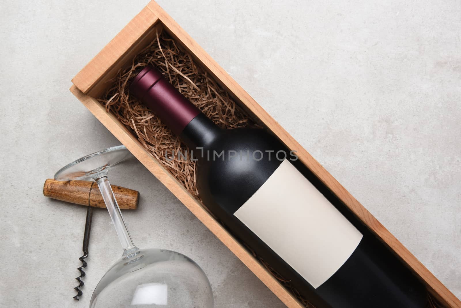 Red Wine bottle in wood case with glasses and corkscrew by sCukrov