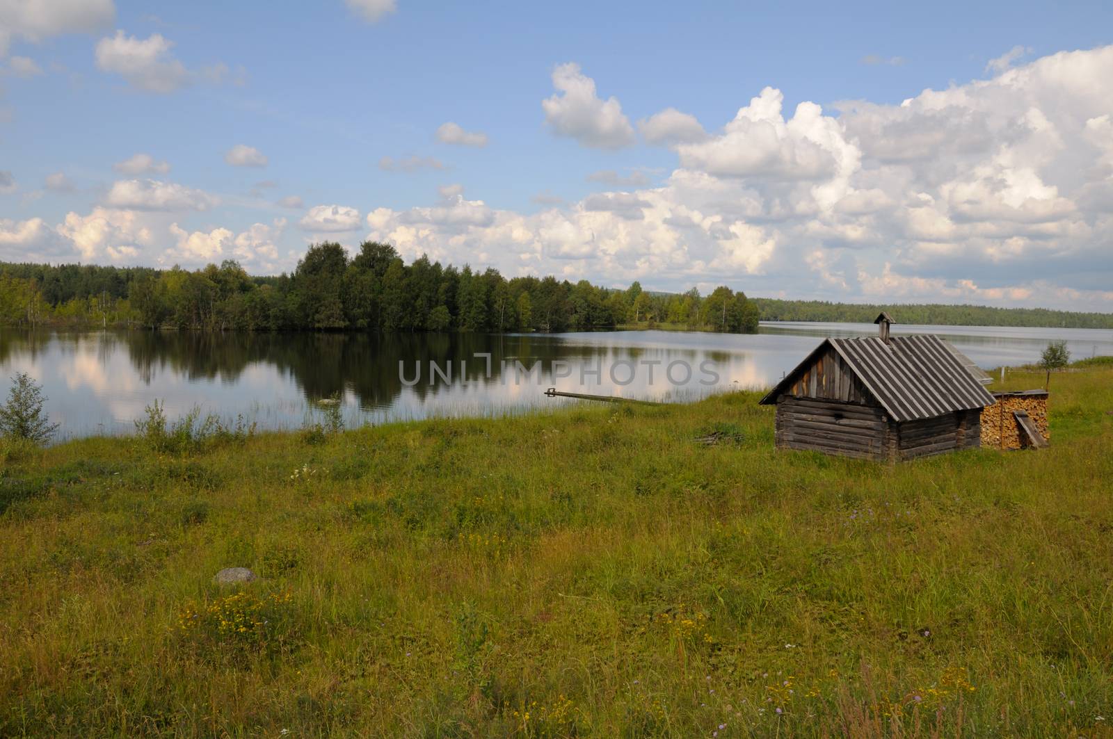 Small bathhouse on a lake shore by nemo269