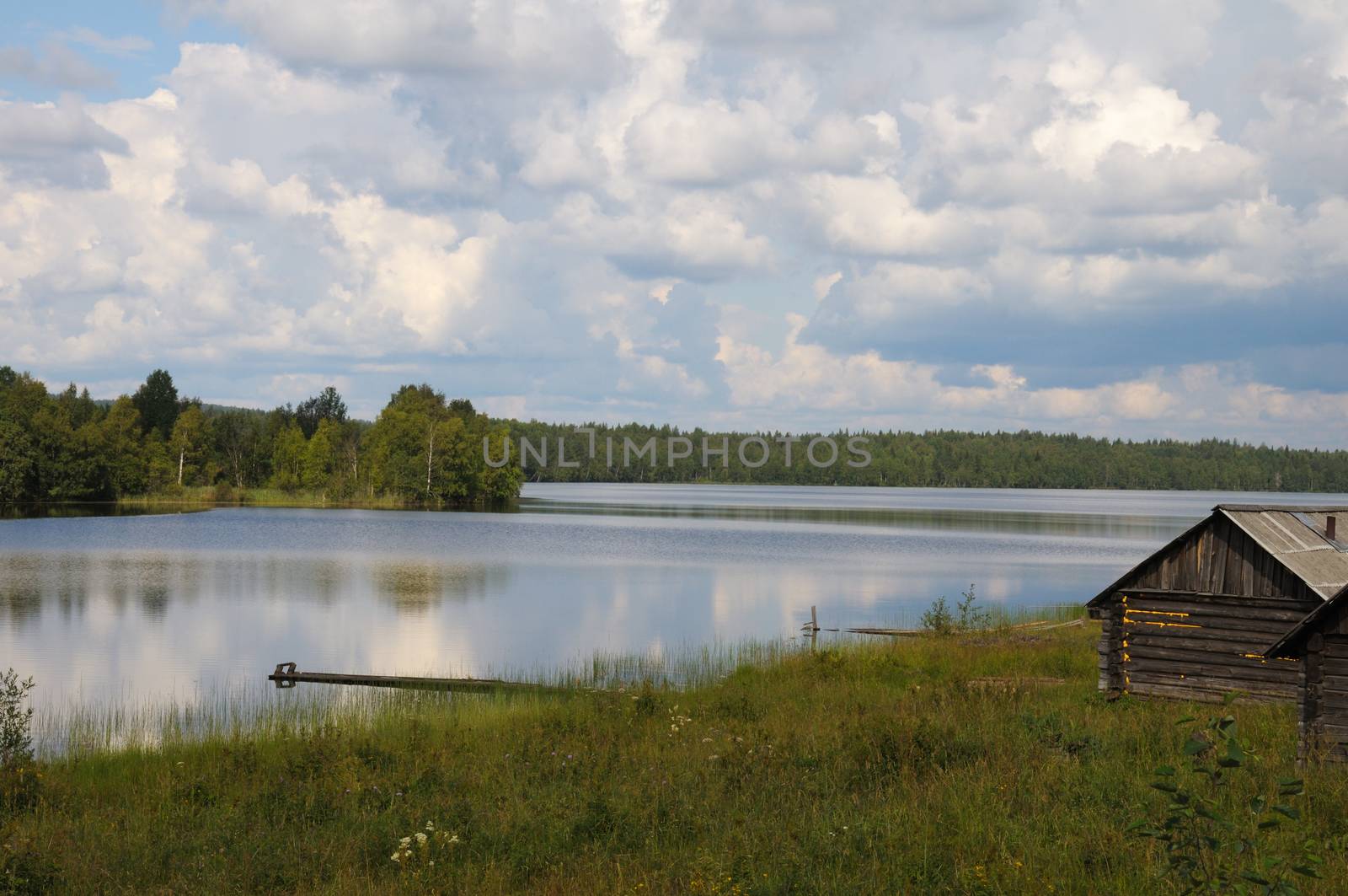 Small bathhouse on a lake shore by nemo269