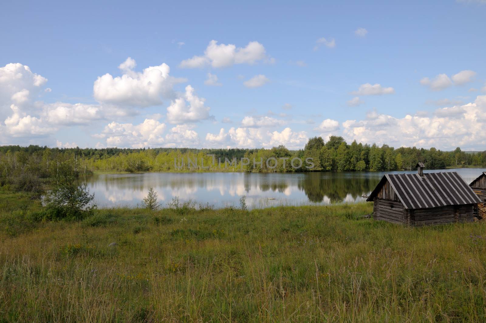 Small bathhouse on a lake shore by nemo269