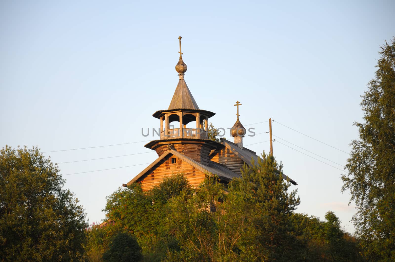 Distant ancient wooden church on a hill by nemo269