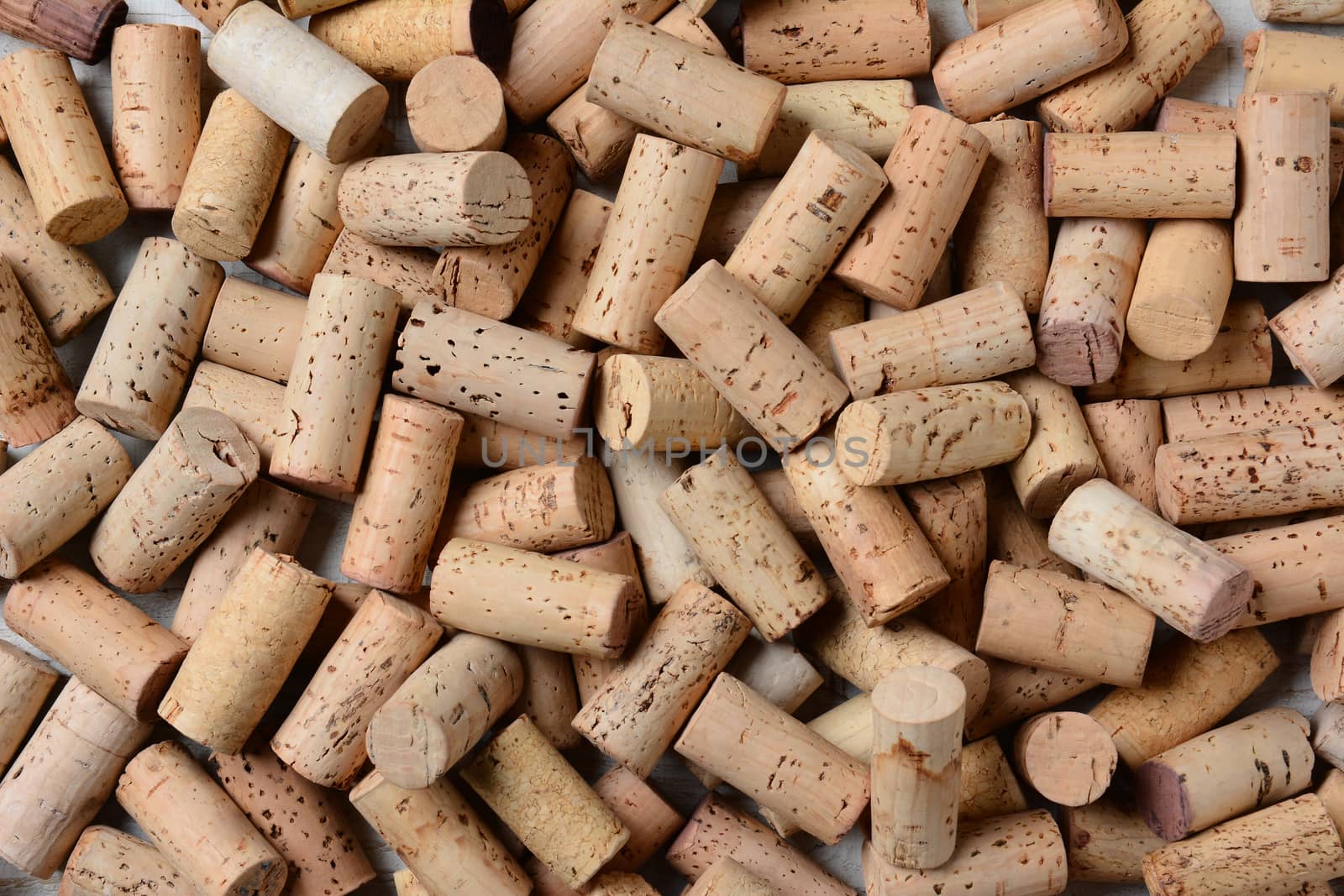 Closeup of a pile of used wine corks. Horizontal format with the corks filling the frame.