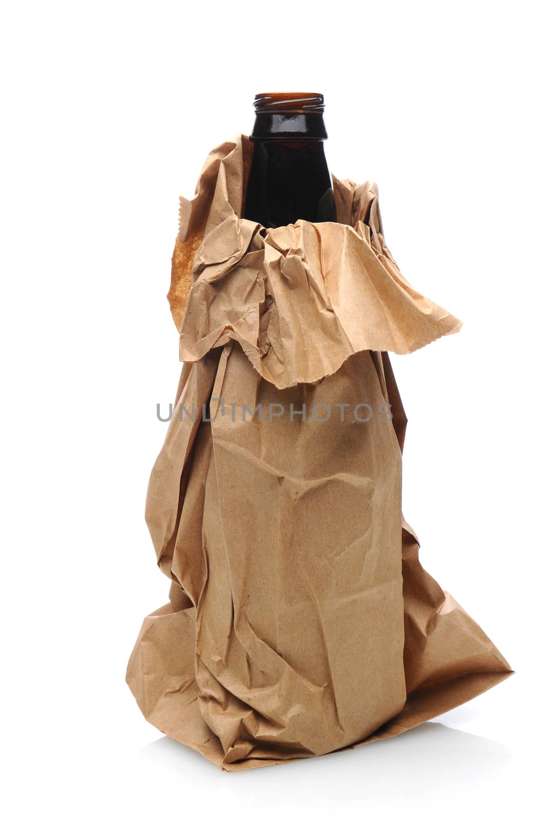 Closeup of a beer bottle inside a brown paper bag. Vertical format, isolated on white with reflection.