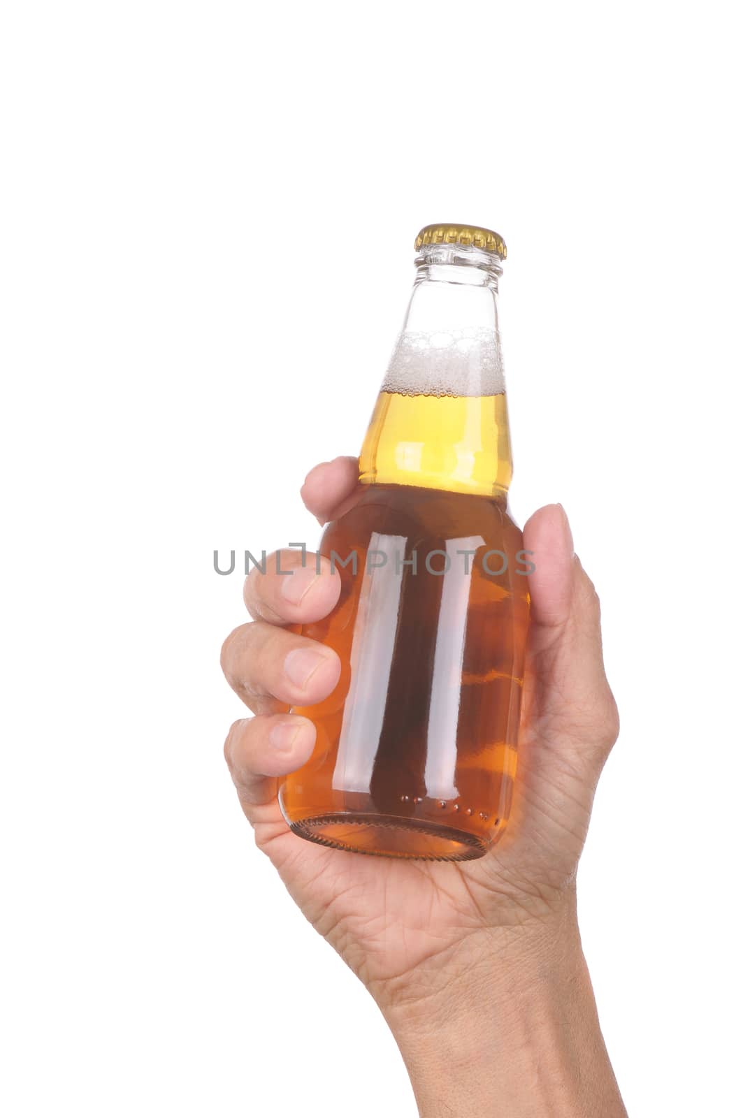 Man's hand holding up a clear beer bottle without label over a white background vertical format
