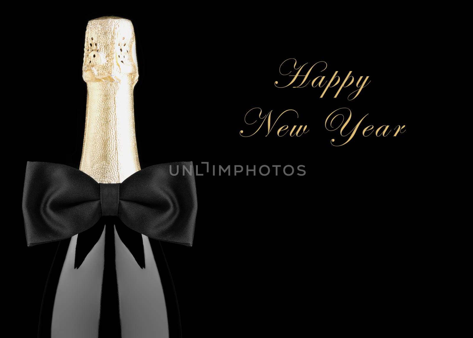 Closeup of a Champagne Bottle with Black Bow Tie isolated on black background with Happy New Year.