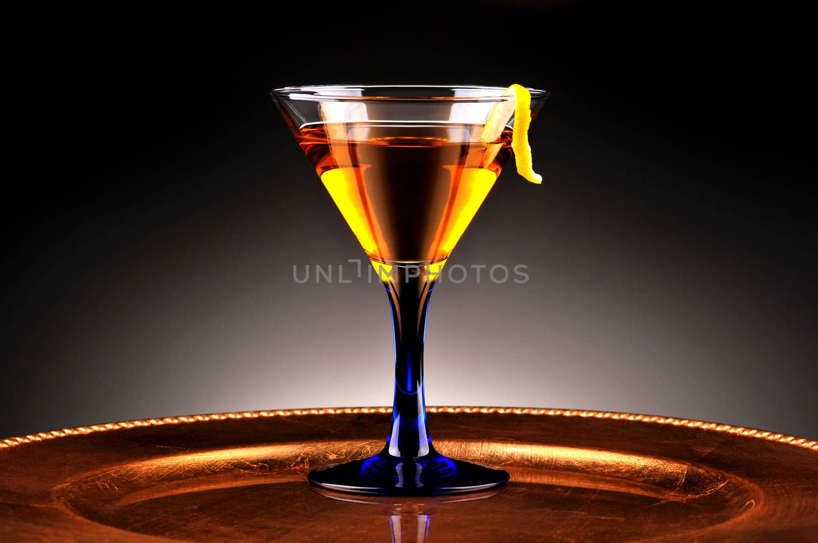 Whiskey cocktail on gold platter by sCukrov