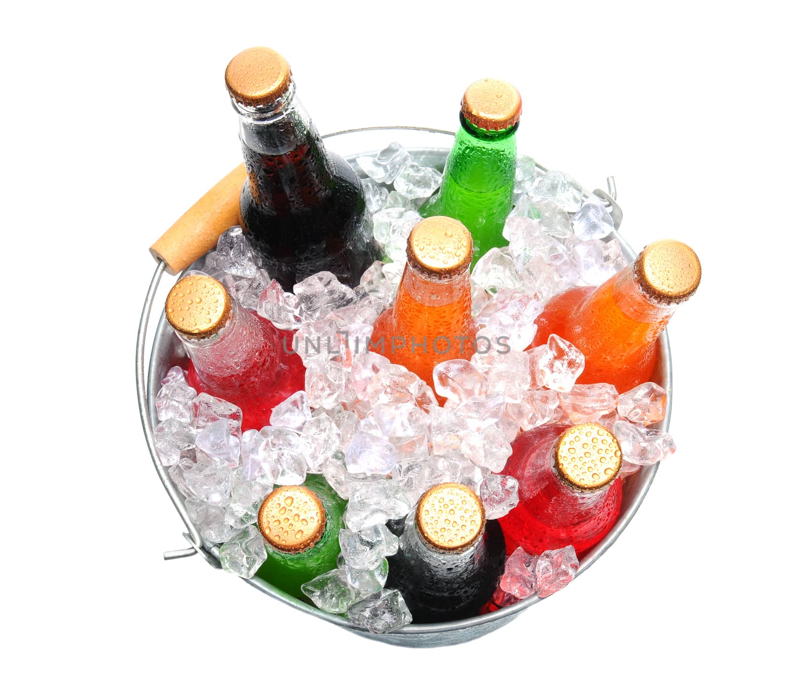 Top view of a bucket full of ice and soda bottles. Isolated over a white background.