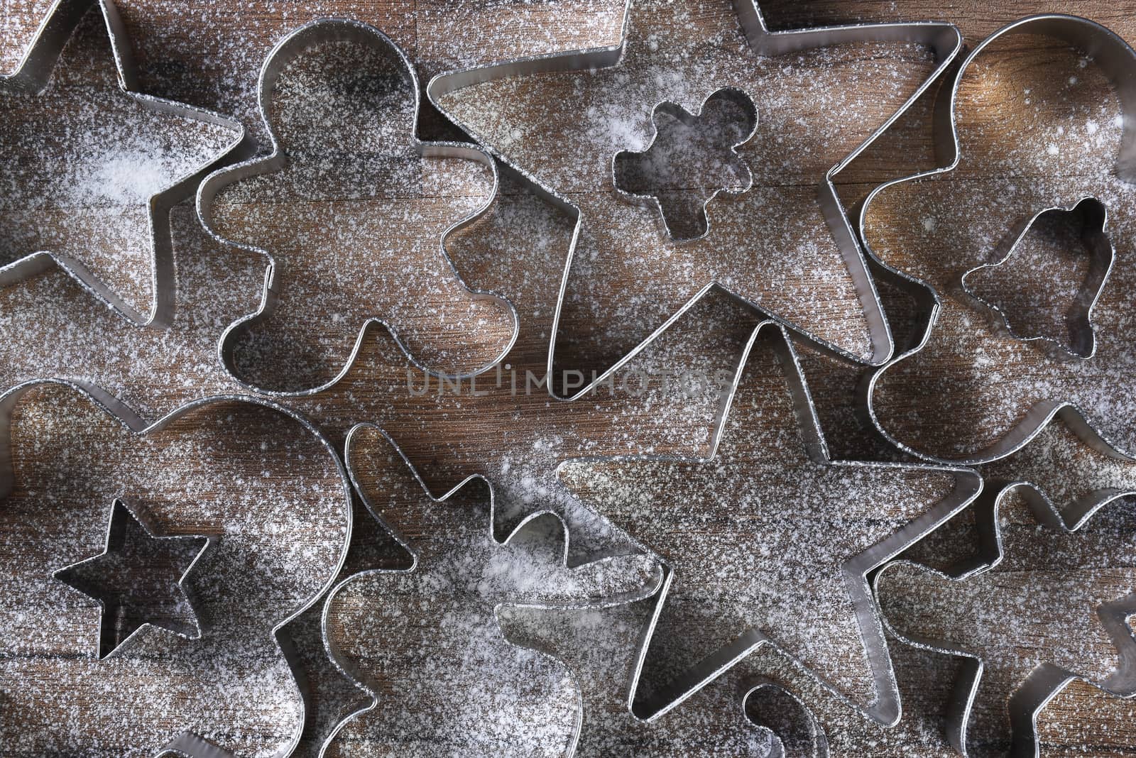 Closeup overhead view of a group of assorted cookie cutters in v by sCukrov