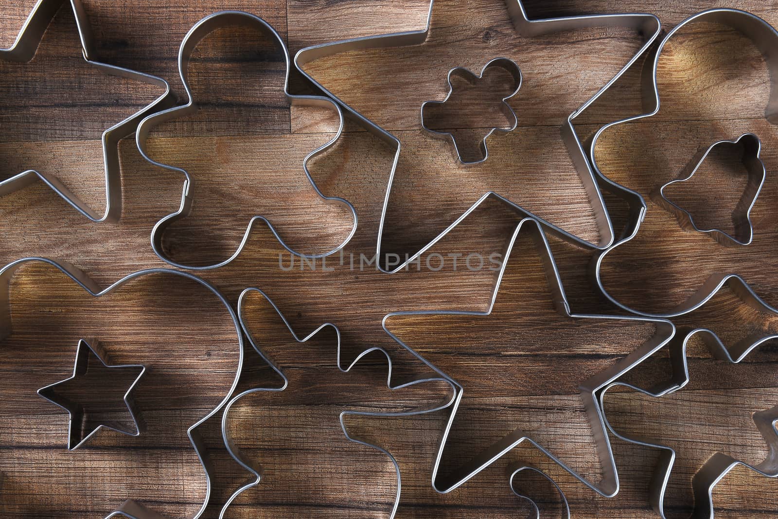 Closeup overhead view of a group of assorted cookie cutters by sCukrov