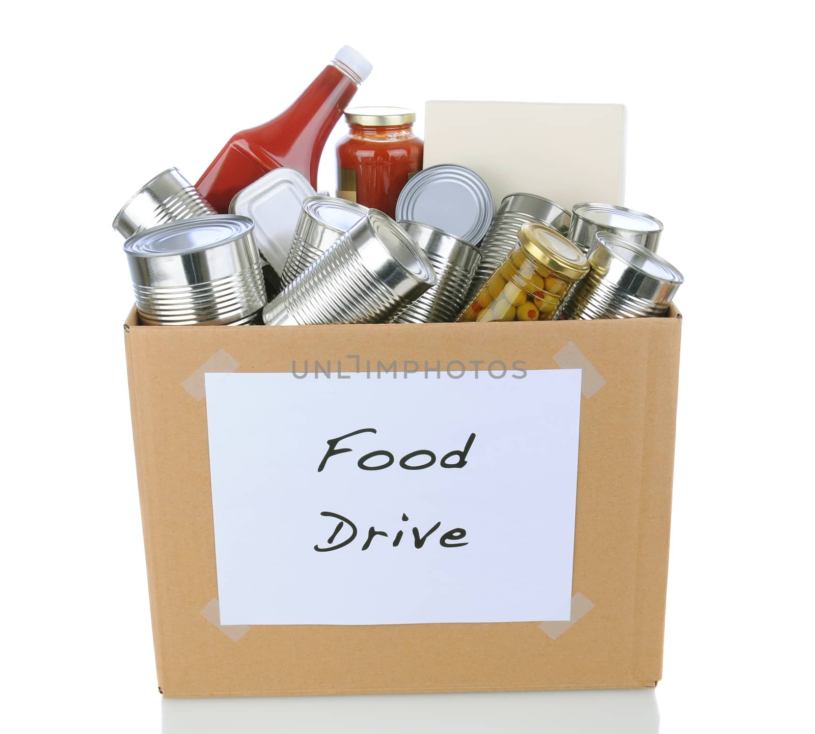 A box full of canned and packaged foodstuff for a charity food donation drive. Isolated on white with reflection.
