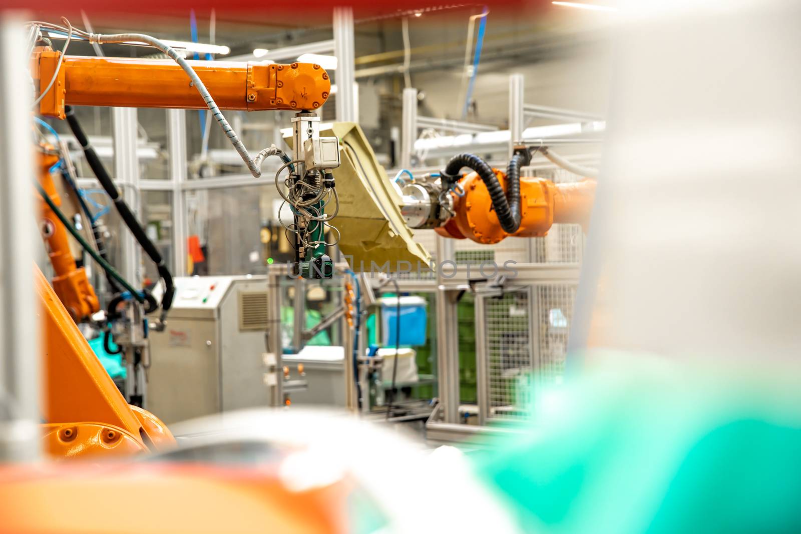 use of robotic arms in the production of cars in the automotive industry.