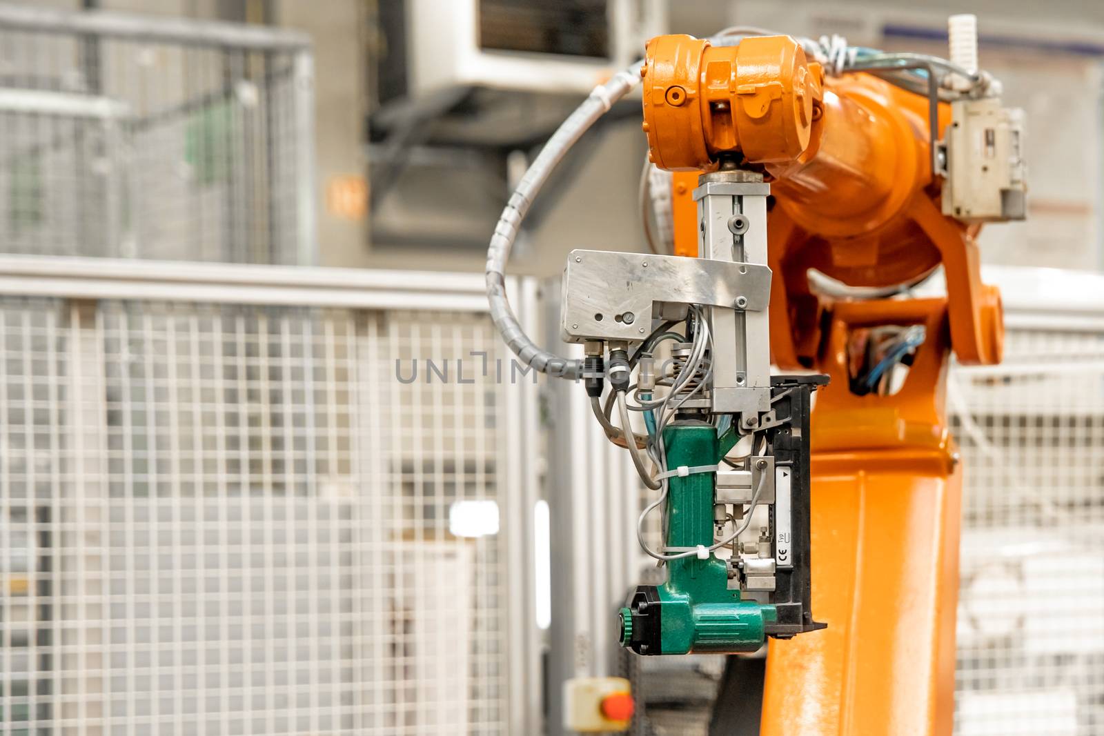 Detail of a robotic arm in a factory, auto industry.
