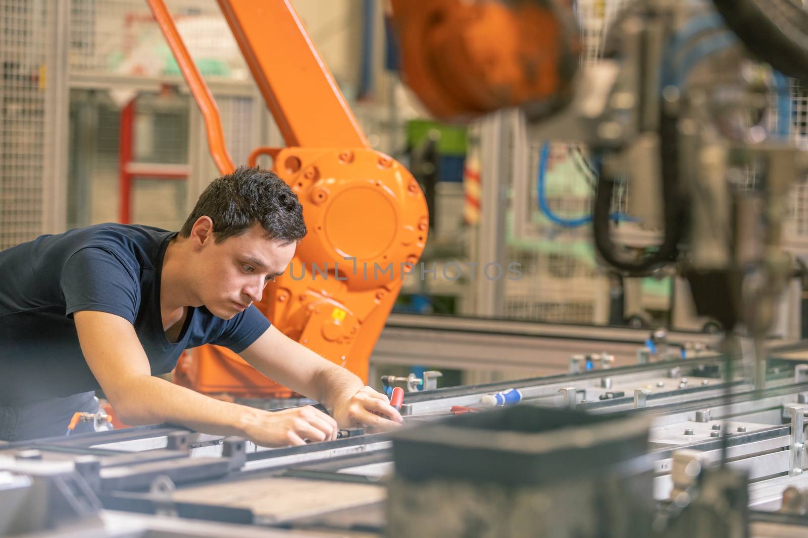 preparing a robot for the production of a new type of cars in the automotive industry by Edophoto