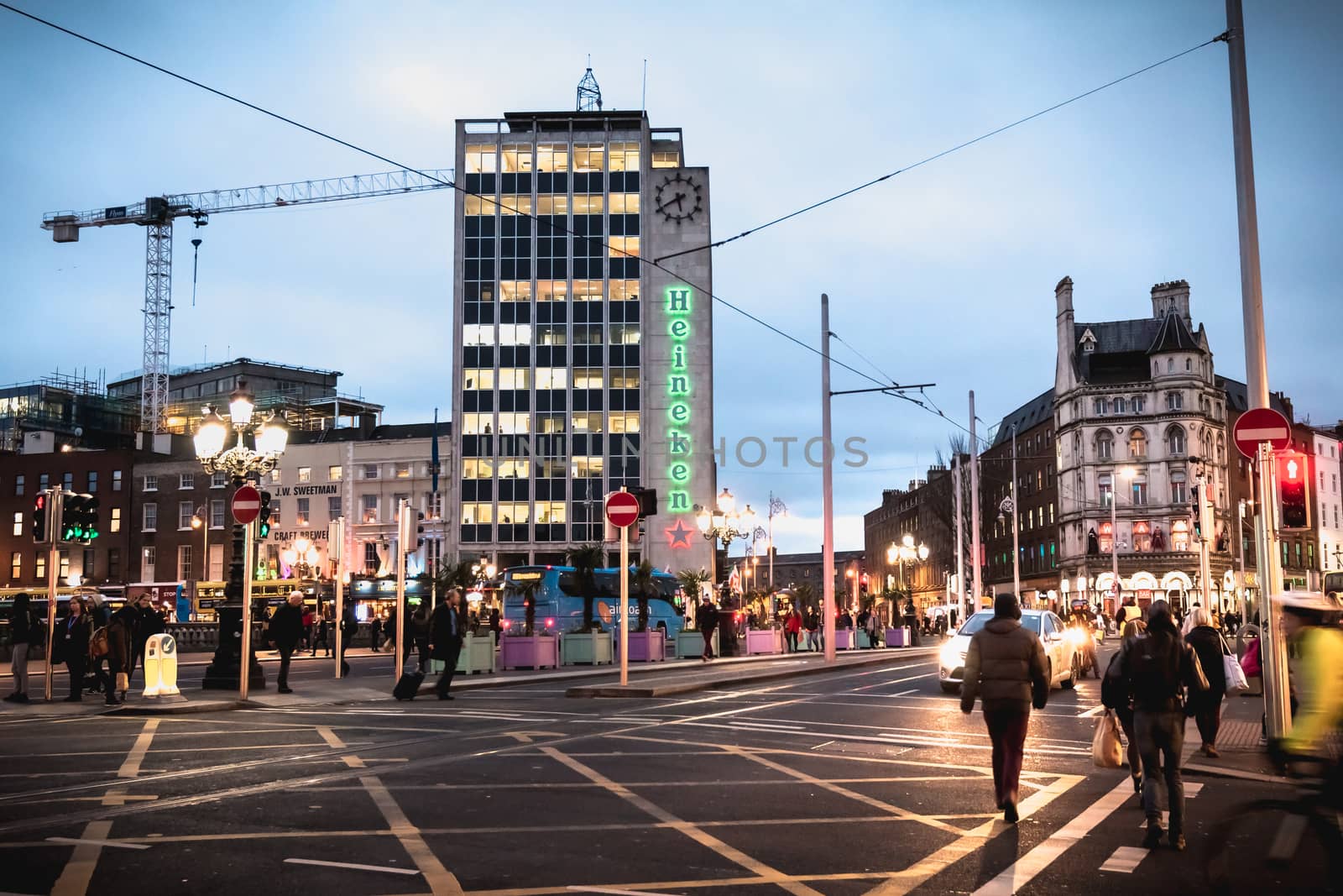 Dublin, Ireland - February 12, 2019: Night street atmosphere in the streets of the historic center where people walk on a winter day