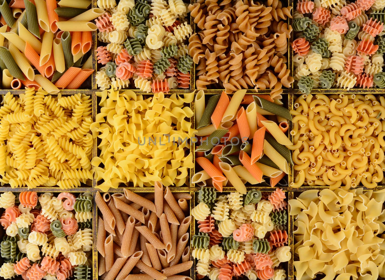 Overhead Closeup view of a divided box filled with different pastas.