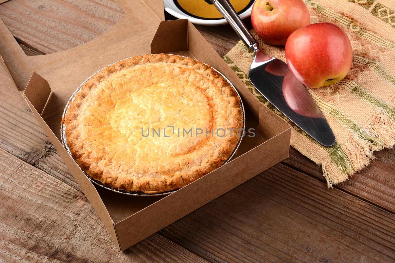 Apple Pie with Fresh Apples on Wood Table by sCukrov