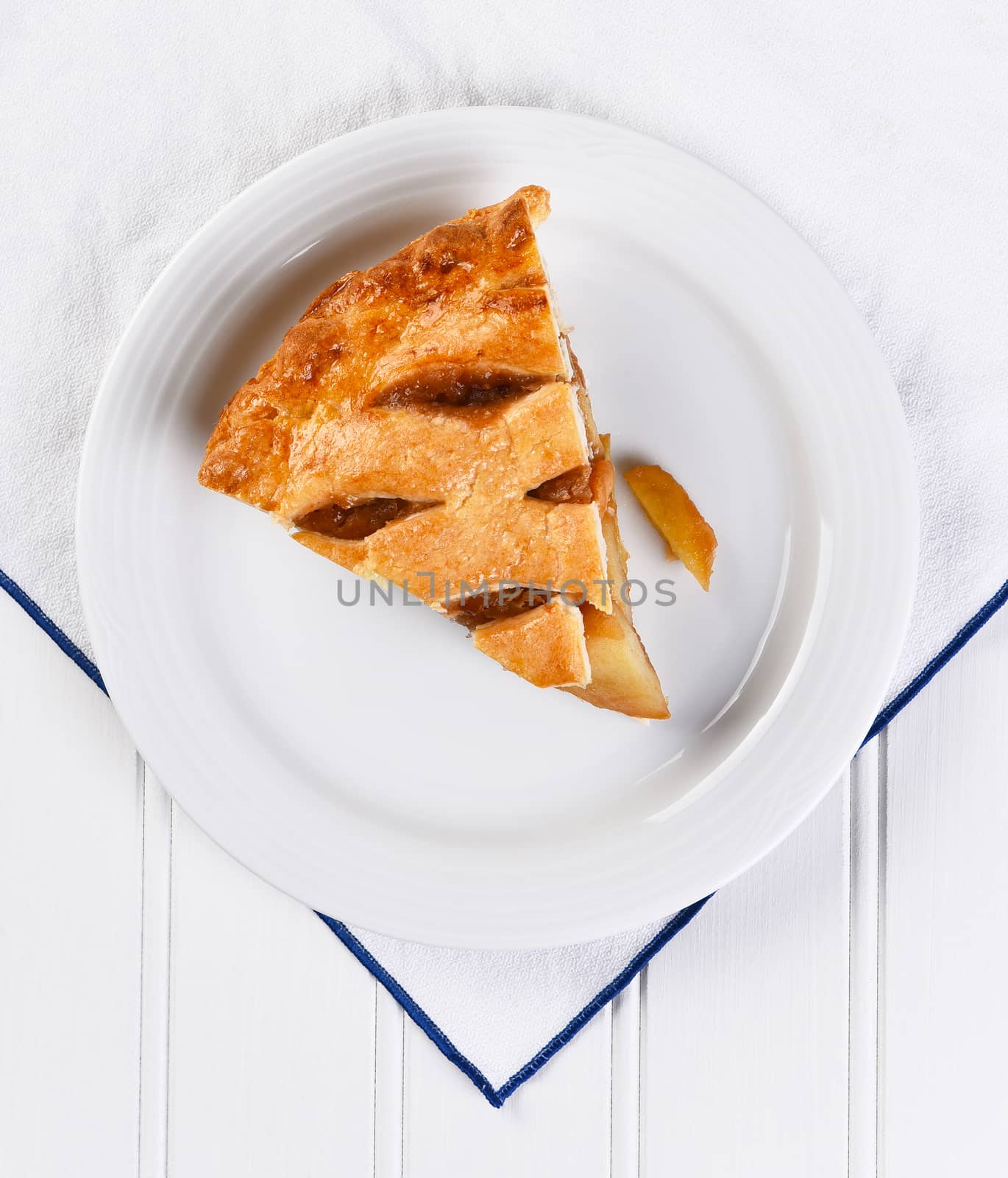 Fresh Baked Apple Pie slice on white plate by sCukrov