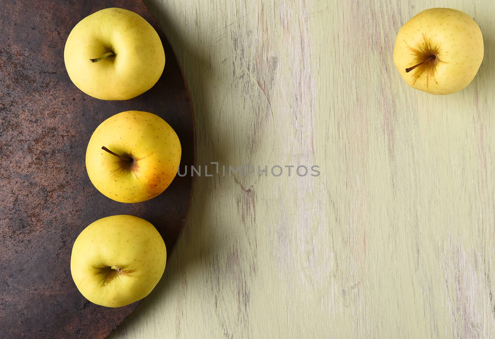 Golden Delicious apples still life with copy space.