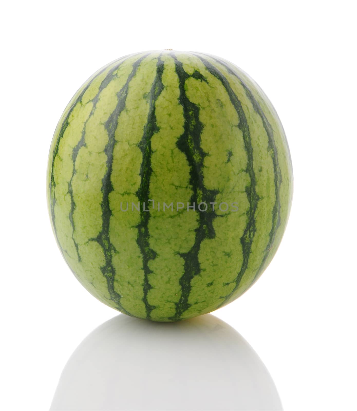 Closeup of a whole mini seedless watermelon on a white surface with reflection. Vertical Format.