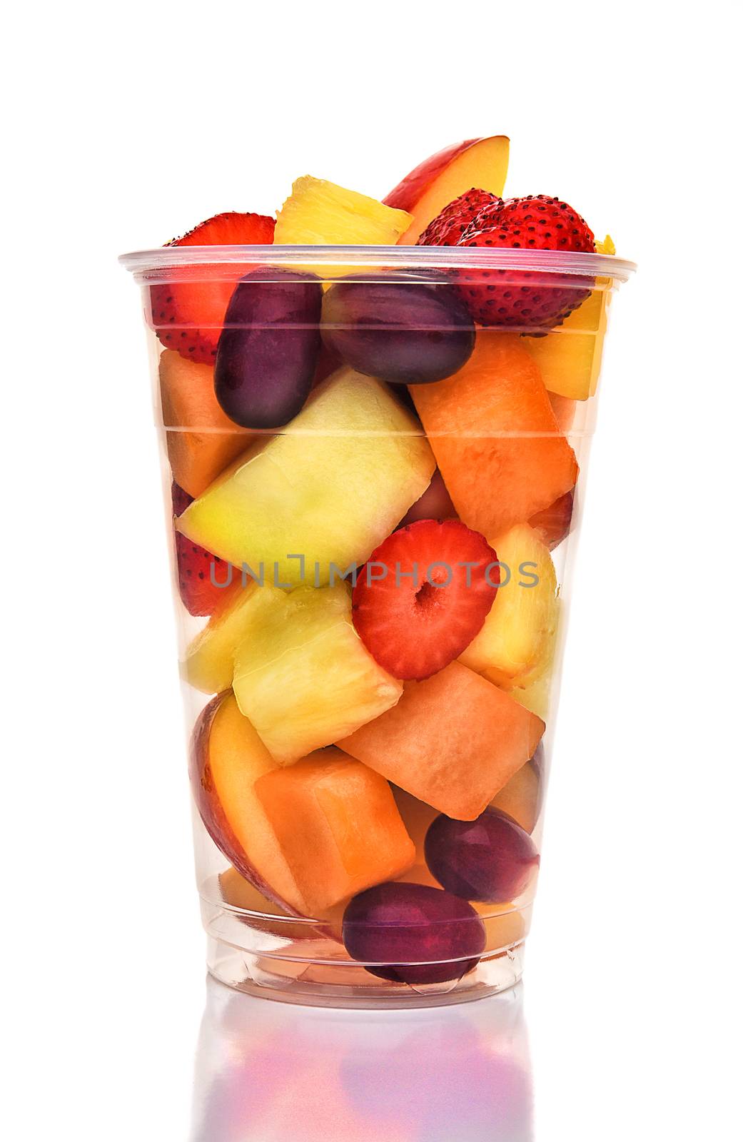 A plastic cup of fresh cut fruit. Isolated on white with reflection, fruits include, Strawberry, Pineapple, Apple, Cantaloupe, Honeydew and Grapes.