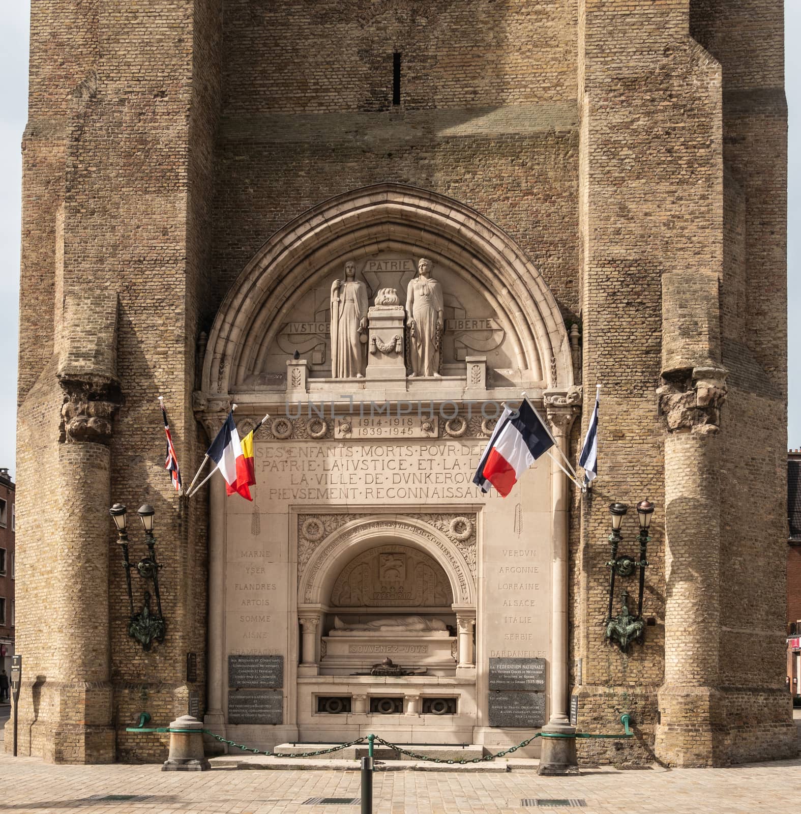 World war memorial at base of Belfry in Dunkirk, France. by Claudine
