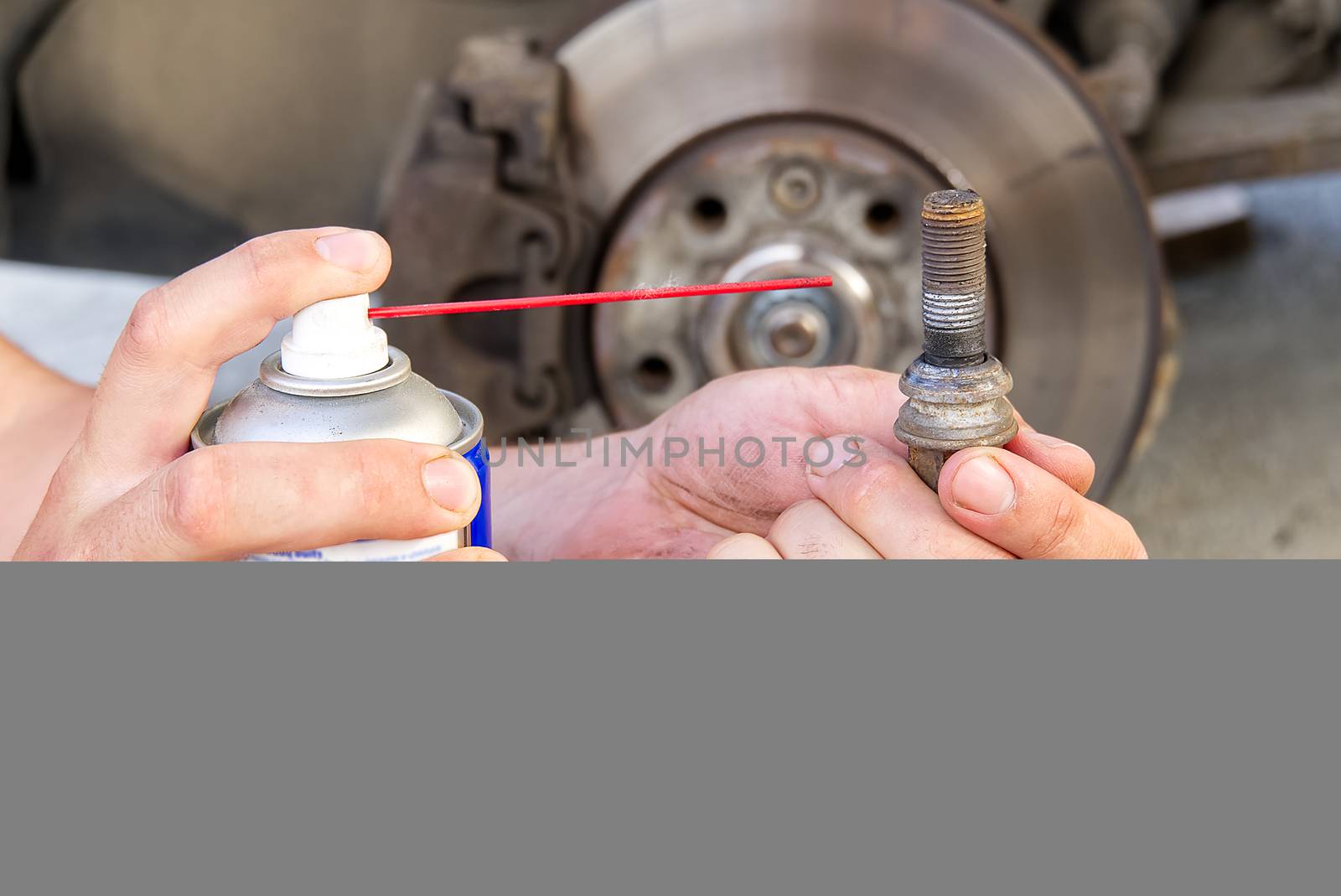 Old and dirty rear dump break of the vehicle for repair. Brakes on a car with removed wheel. Detail image of cars break assembly before repair, selective focus