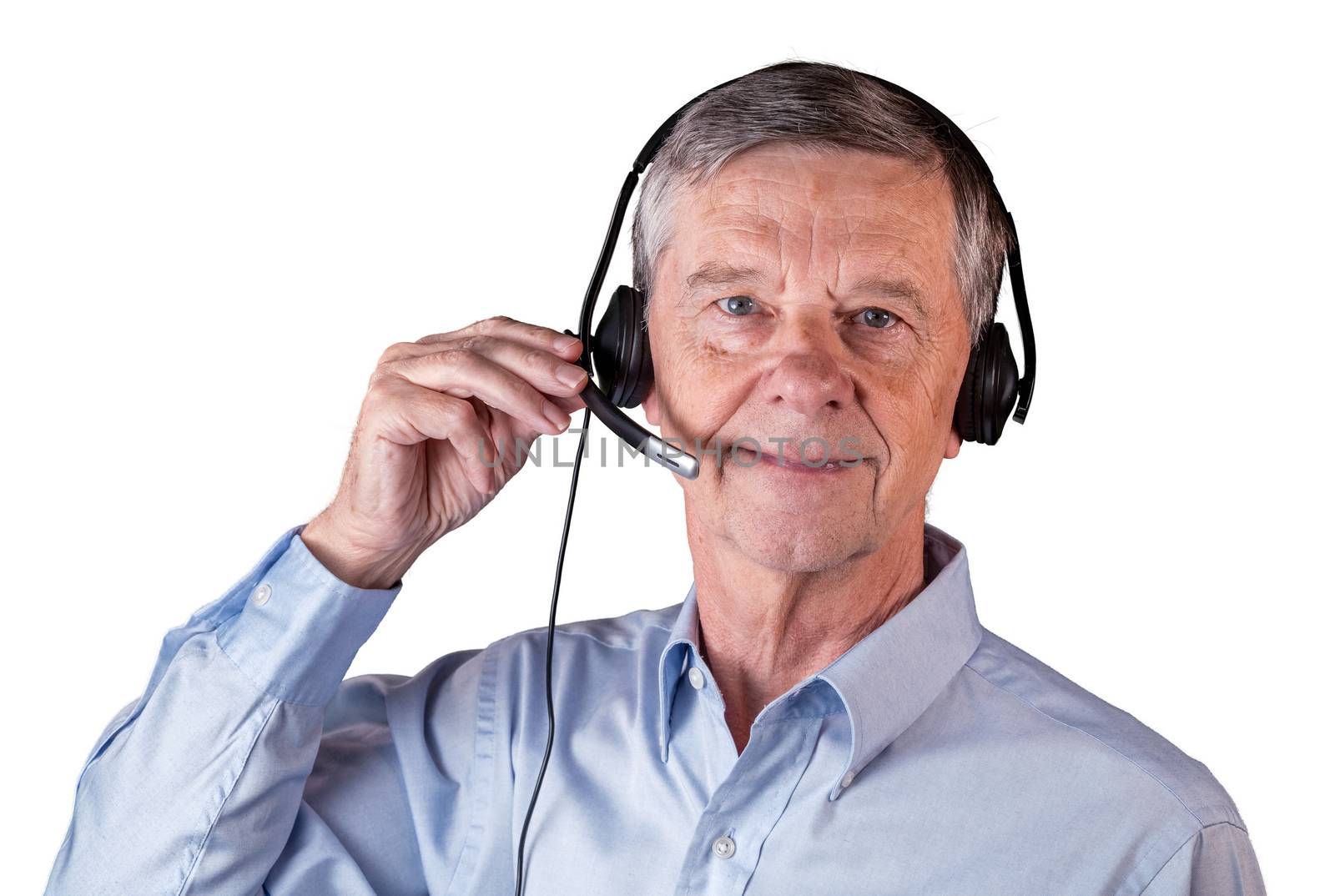 Senior caucasian man using headset to talk to customers or team in work from home. Isolated against white background