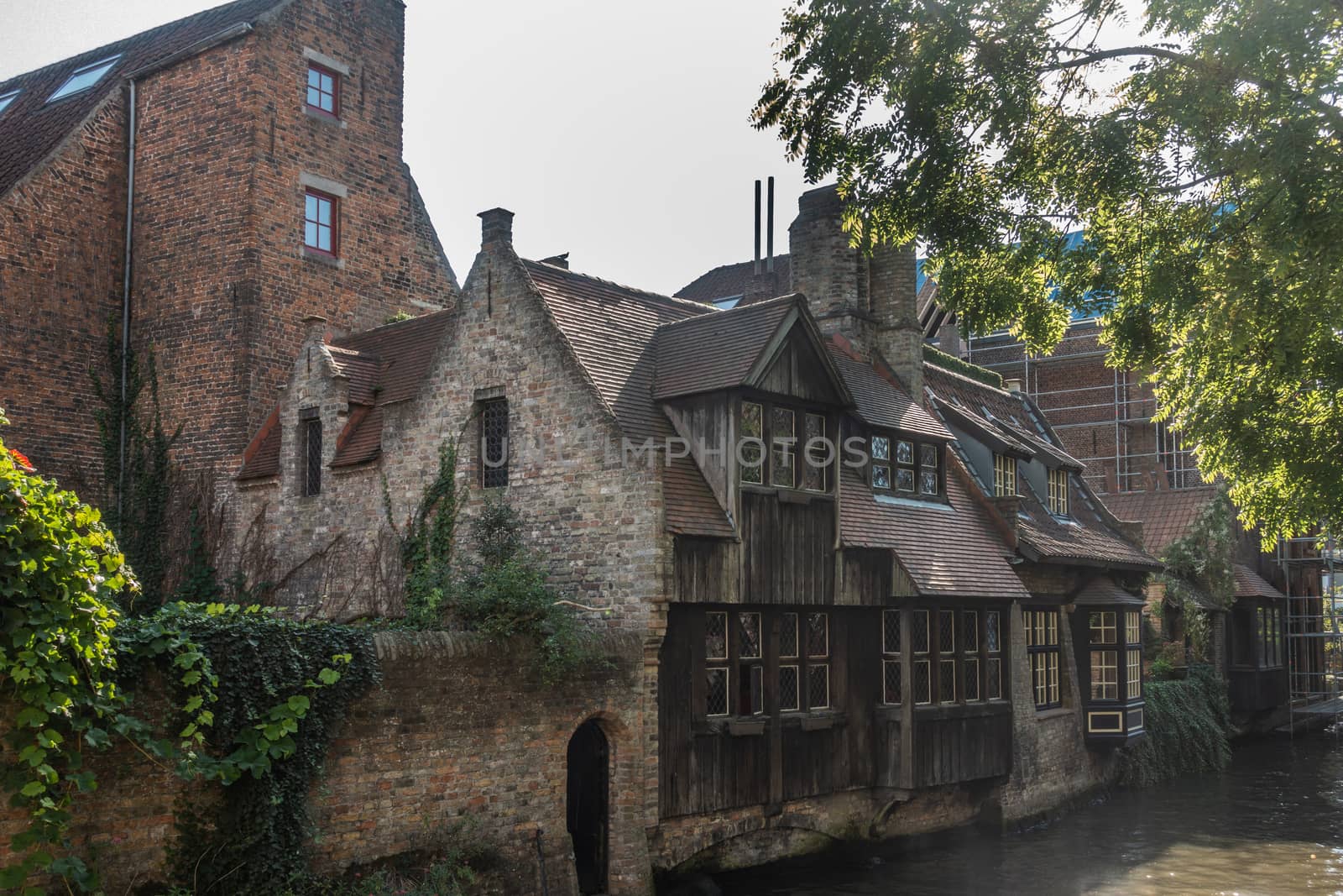 Old houses along Bruges canals, Belgium. by Claudine