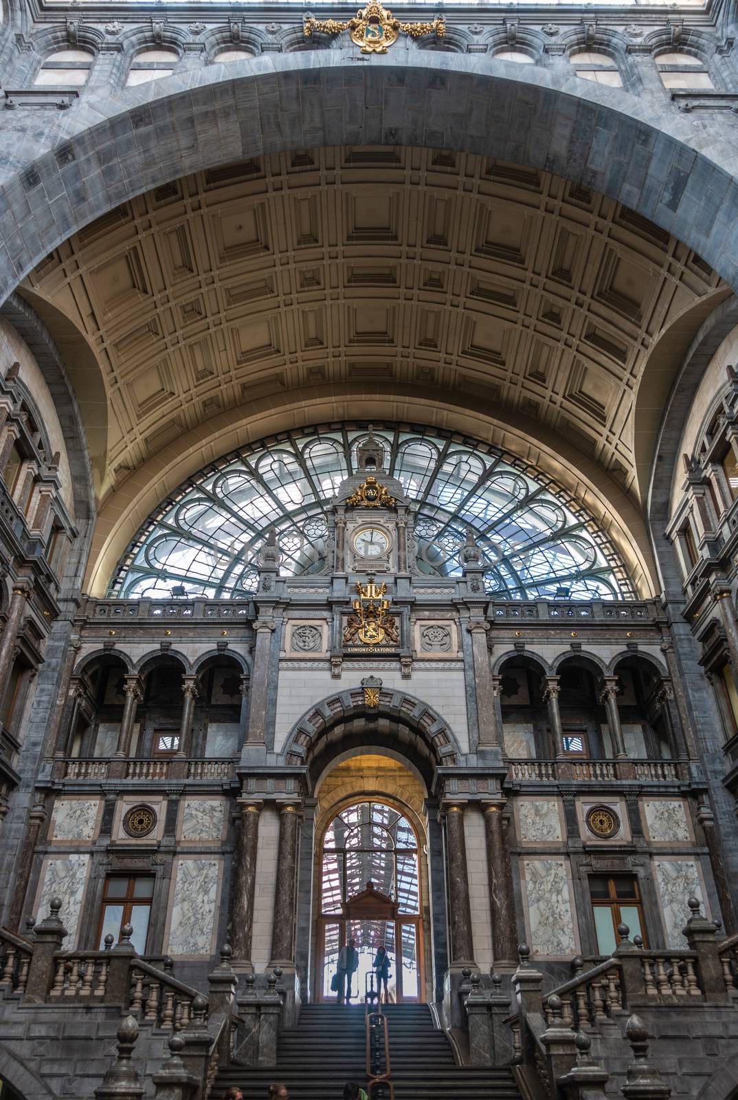 Arch over stairs to train hall at Antwerp Central Station, Belgi by Claudine