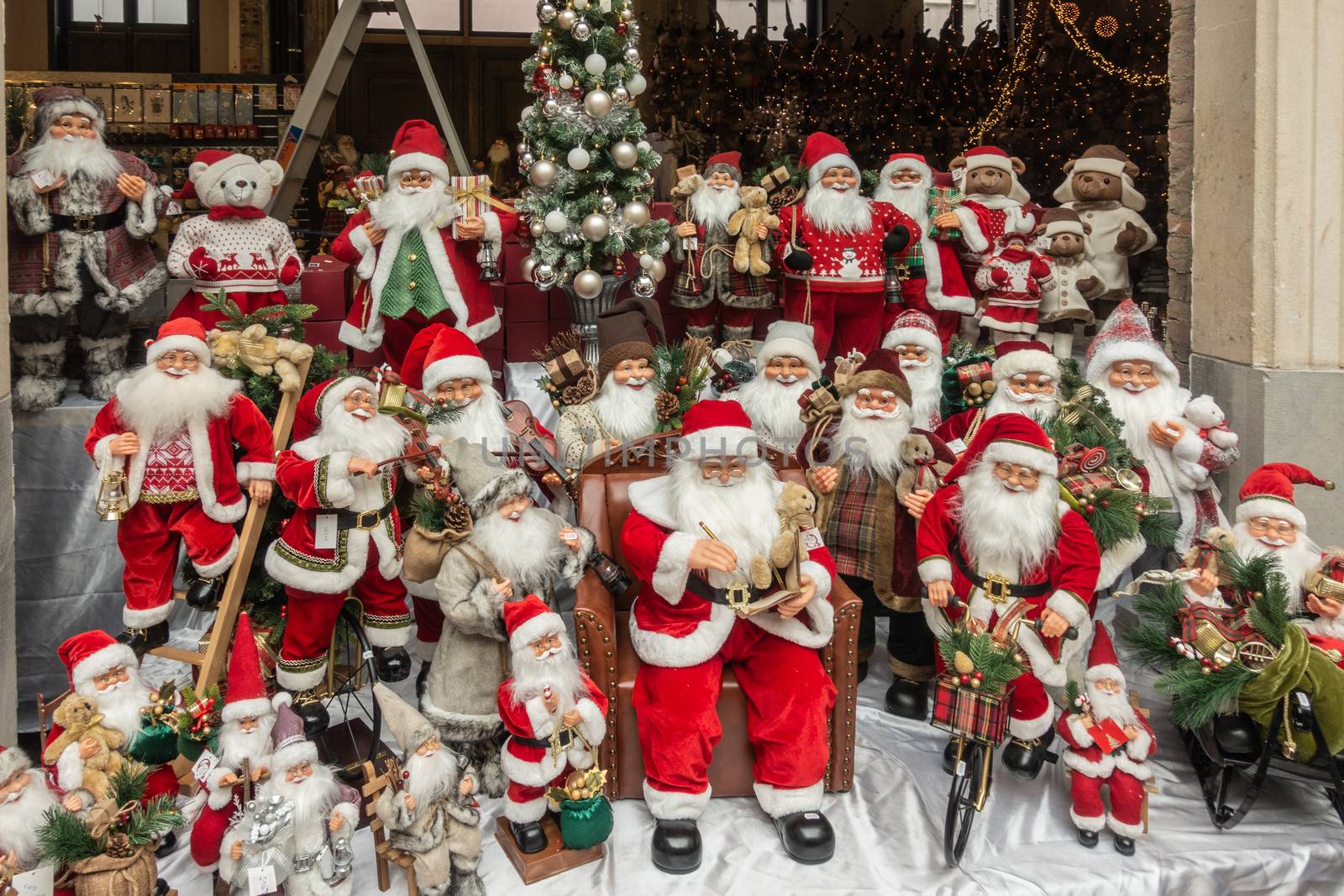 Santa Claus group display in Christmas store, Antwerp Belgium. by Claudine