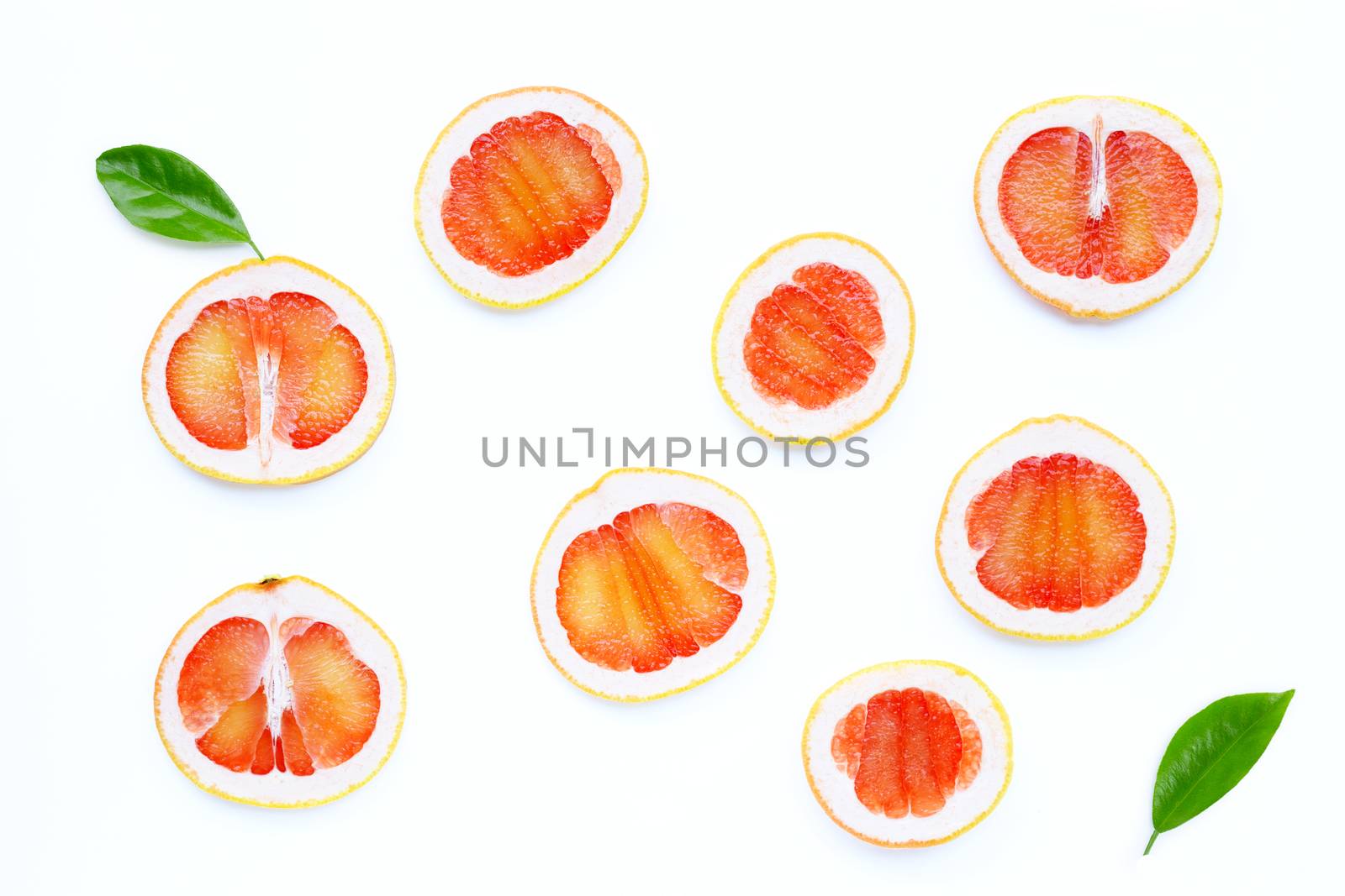 High vitamin C. Juicy grapefruit slices on white background.
