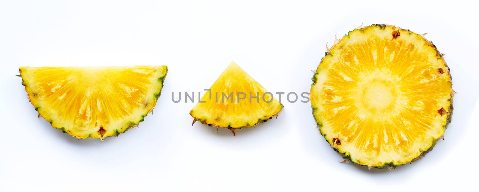 Fresh pineapple slices on white background. by Bowonpat