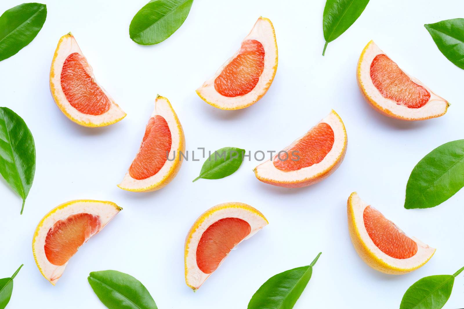 High vitamin C. Juicy grapefruit slices on white background.