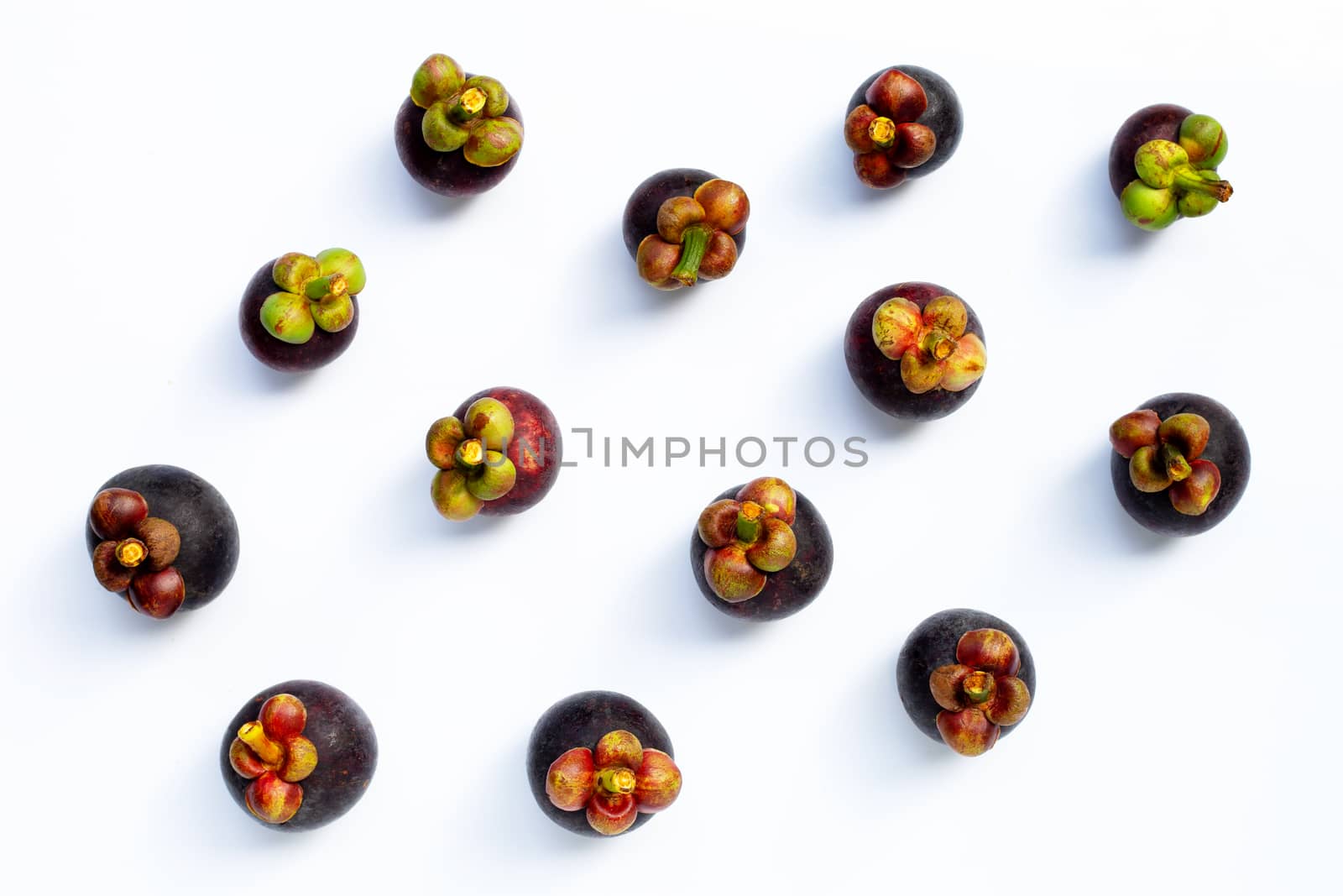 Mangosteen on white background. Top view