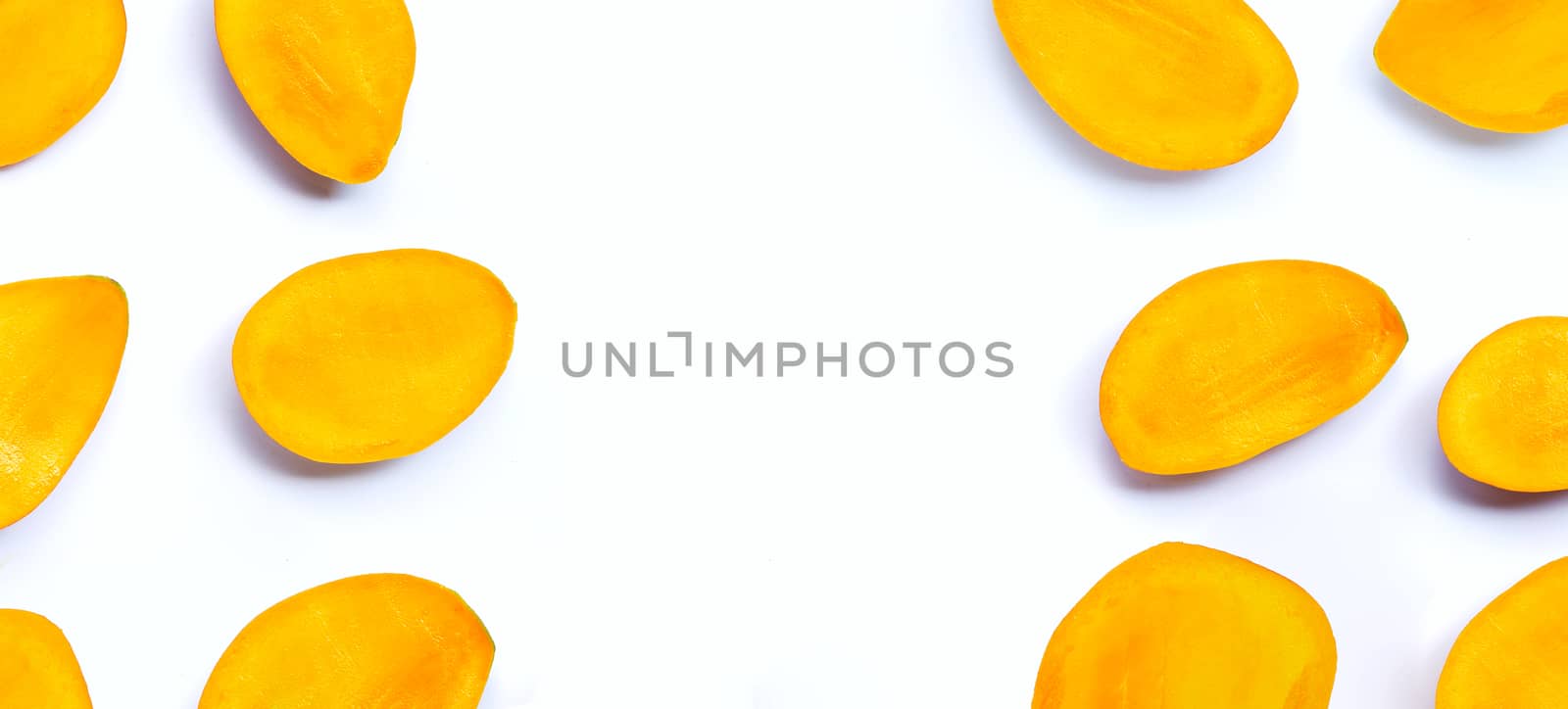 Tropical fruit, Mango slices on white background. Copy space